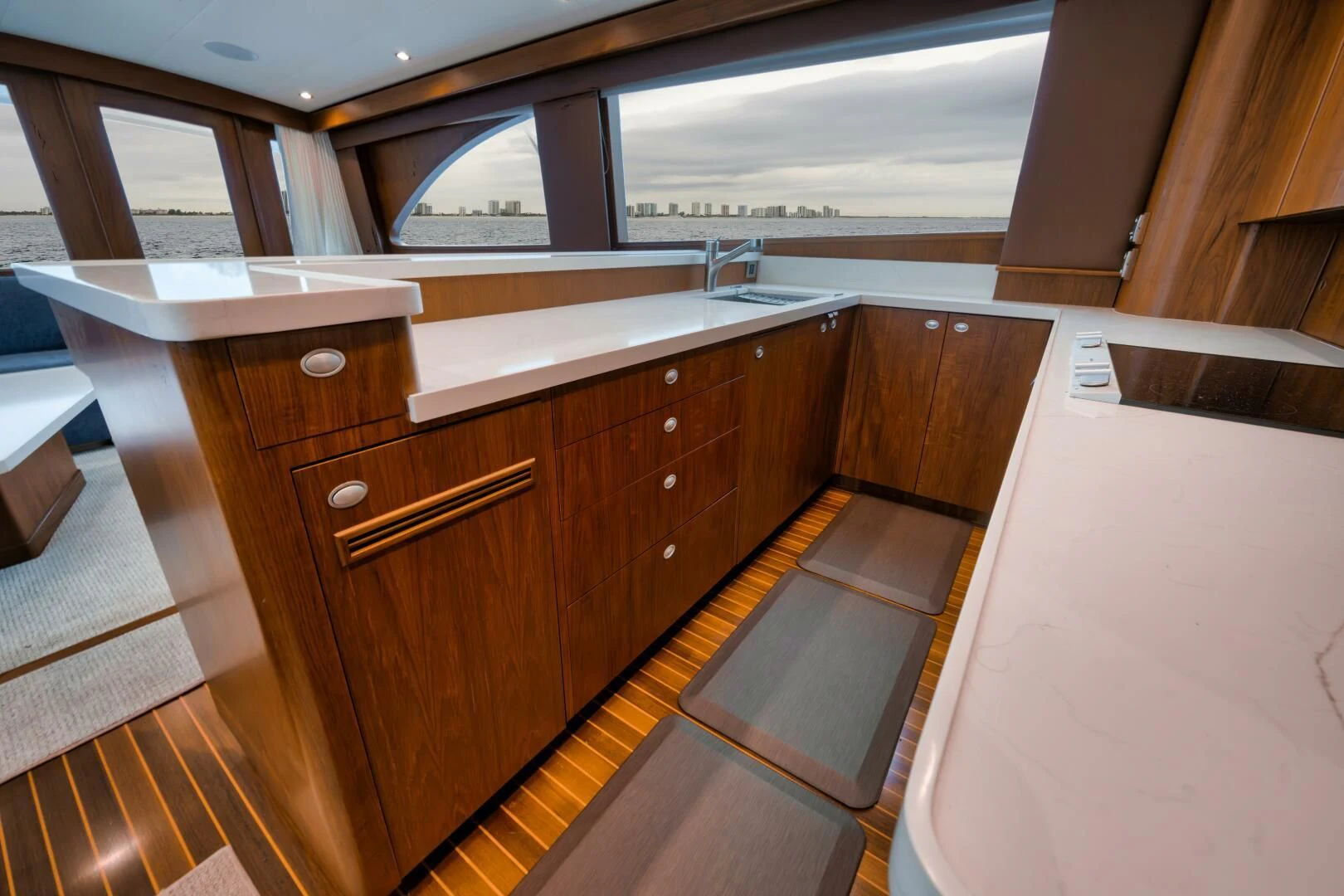 a kitchen with wooden cabinets aboard W Yacht for Sale