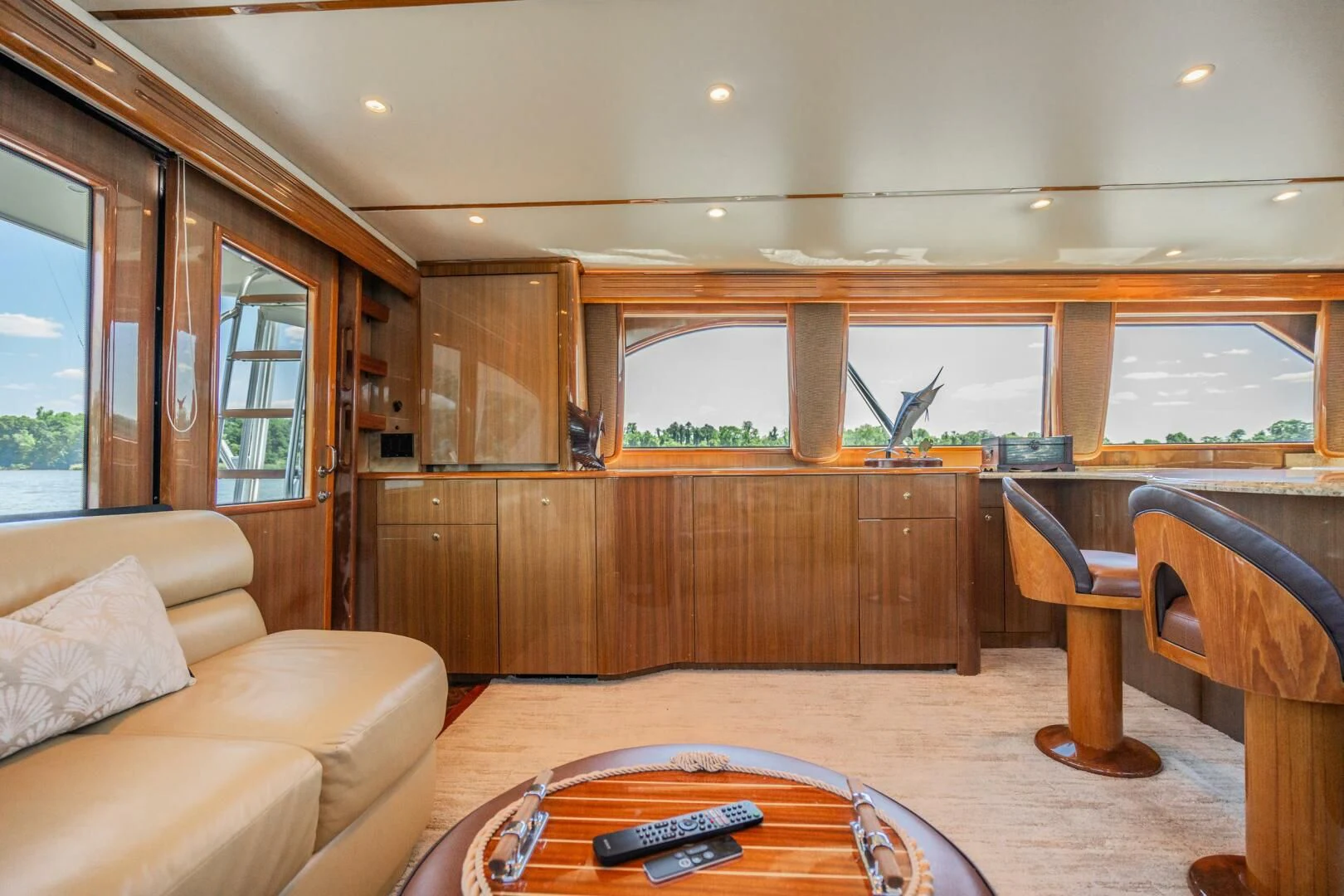 a living room with a wood table aboard W Yacht for Sale