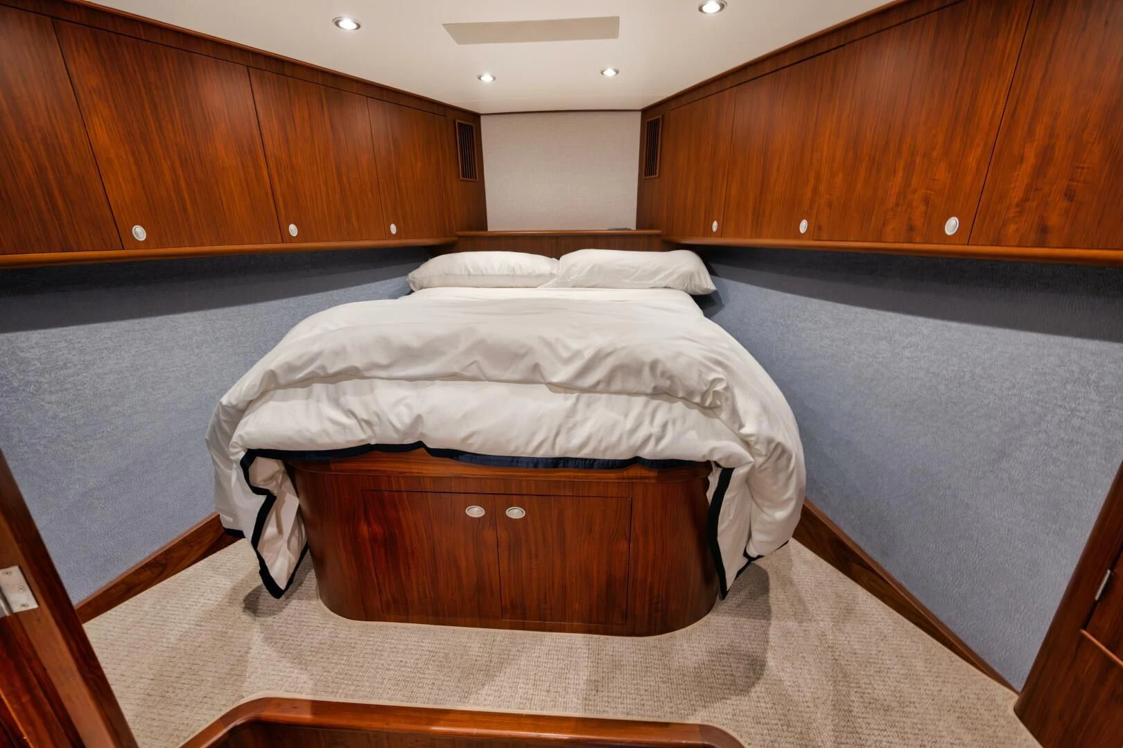 a room with wooden cabinets aboard W Yacht for Sale
