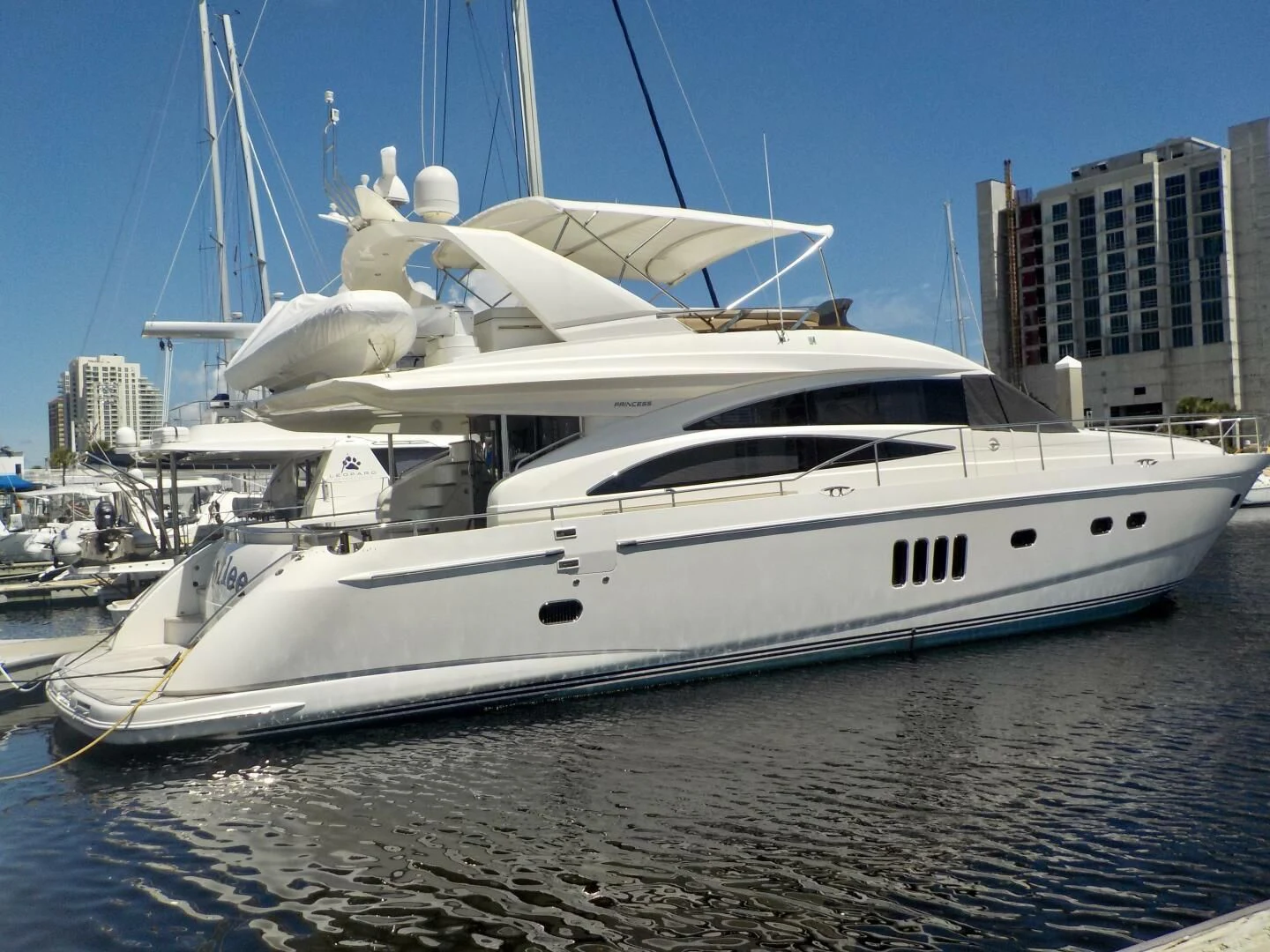 a white yacht in a harbor aboard W Yacht for Sale
