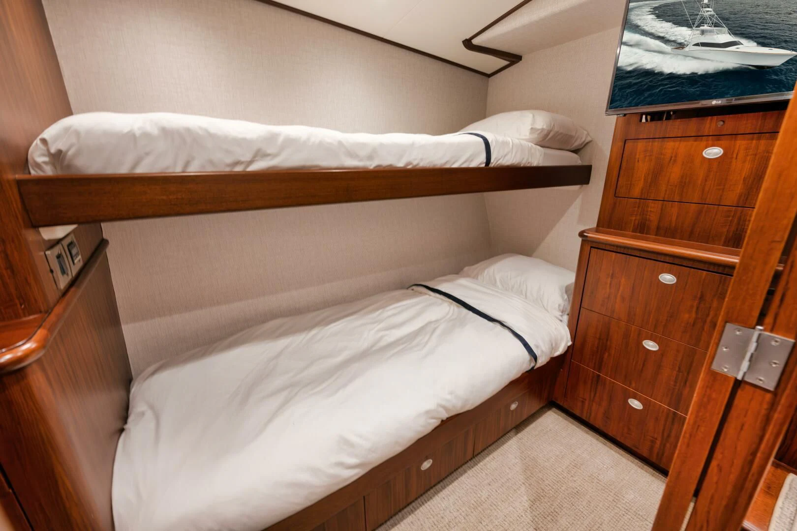 a bed with white sheets aboard W Yacht for Sale