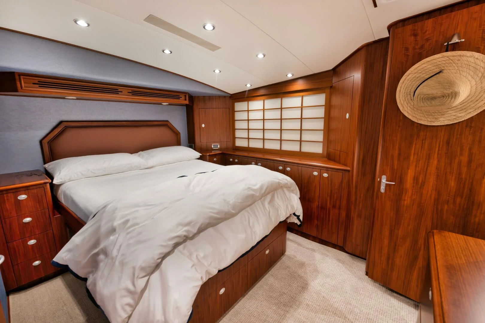 a room with wooden walls and a bed aboard W Yacht for Sale