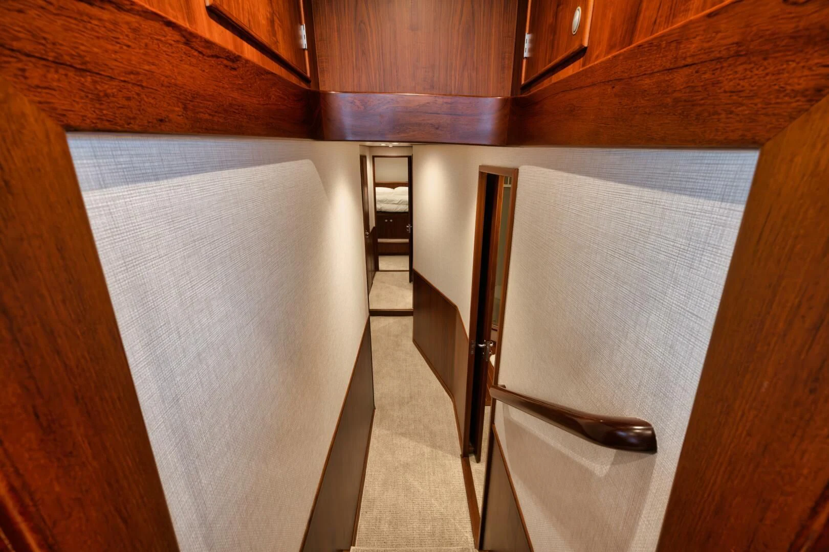a room with wooden cabinets aboard W Yacht for Sale