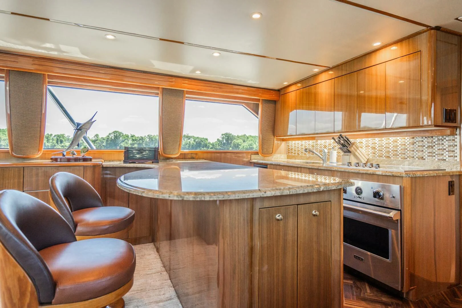 a kitchen with wooden cabinets aboard W Yacht for Sale
