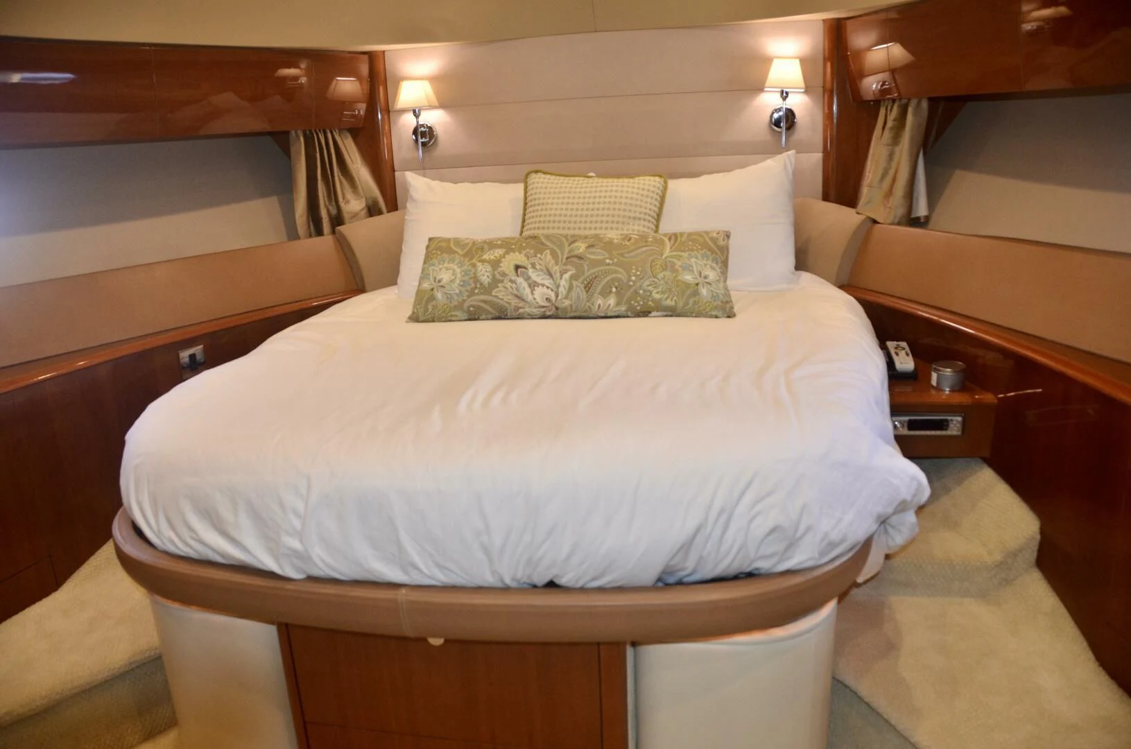 a bed with white sheets aboard W Yacht for Sale