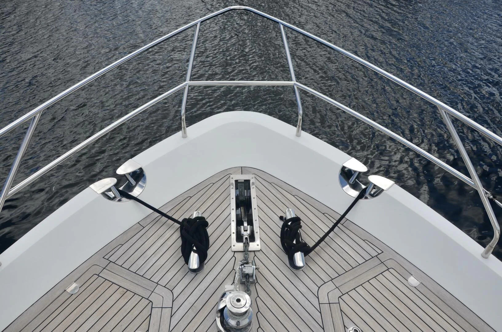 a group of people walking on a white platform with cars on it aboard W Yacht for Sale