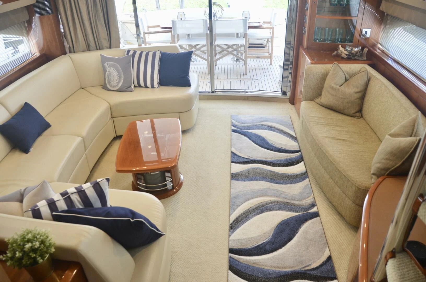 a living room with a couch and a table aboard W Yacht for Sale