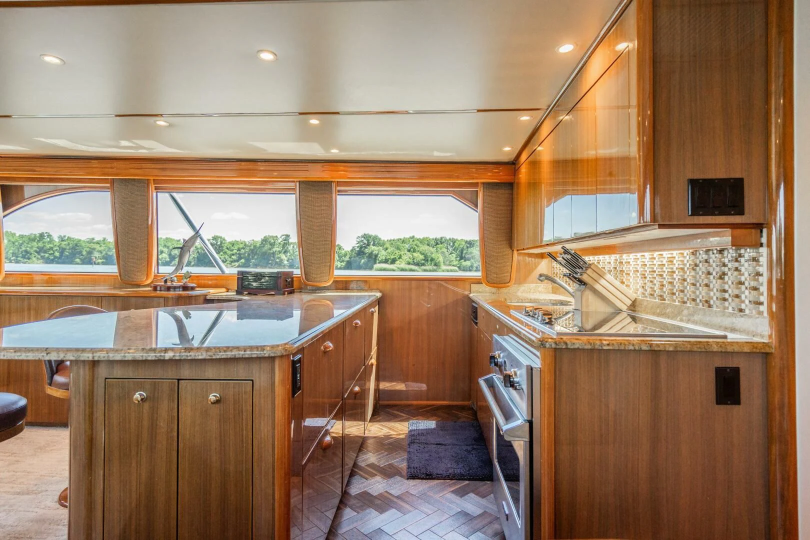 a kitchen with wooden cabinets aboard W Yacht for Sale