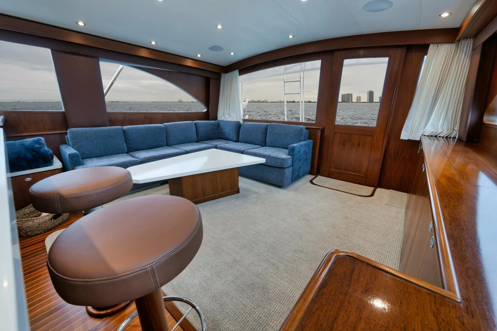 a living room with a couch and a table aboard W Yacht for Sale