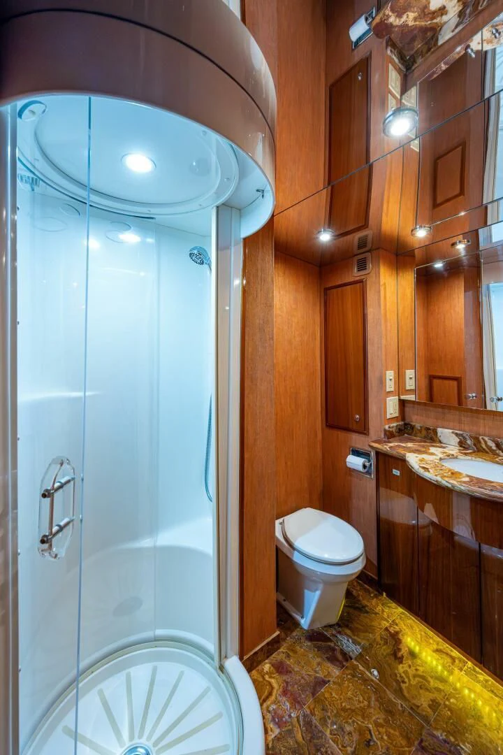 a bathroom with a glass shower aboard W Yacht for Sale
