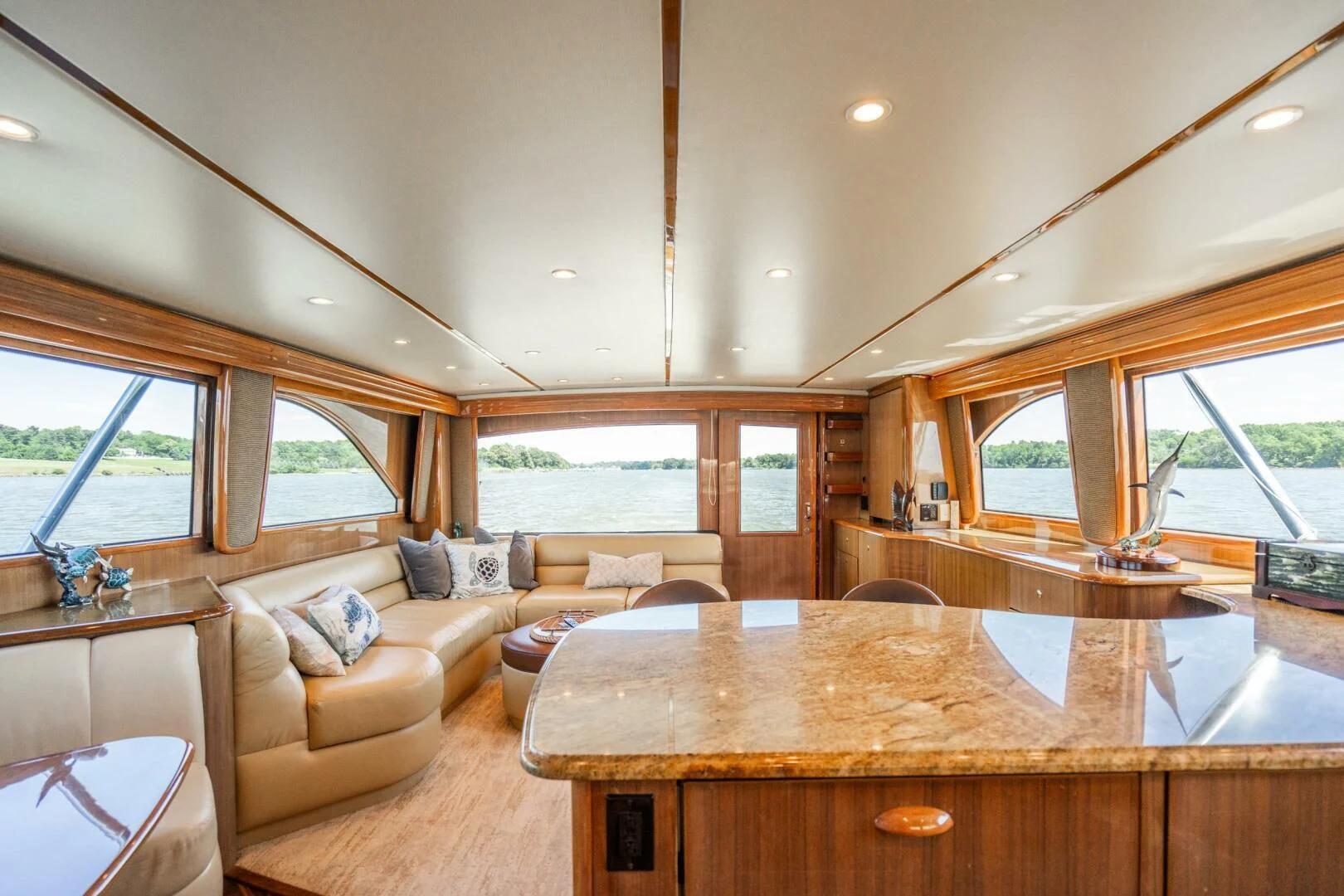 a living room with a large table aboard W Yacht for Sale