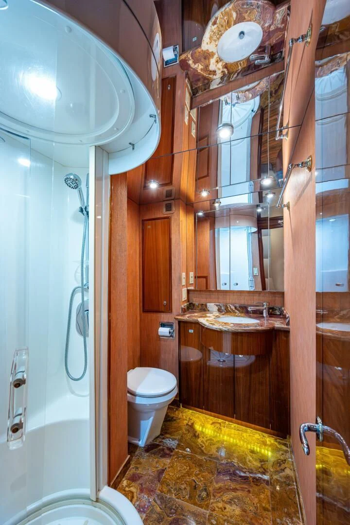 a bathroom with a toilet and sink aboard W Yacht for Sale