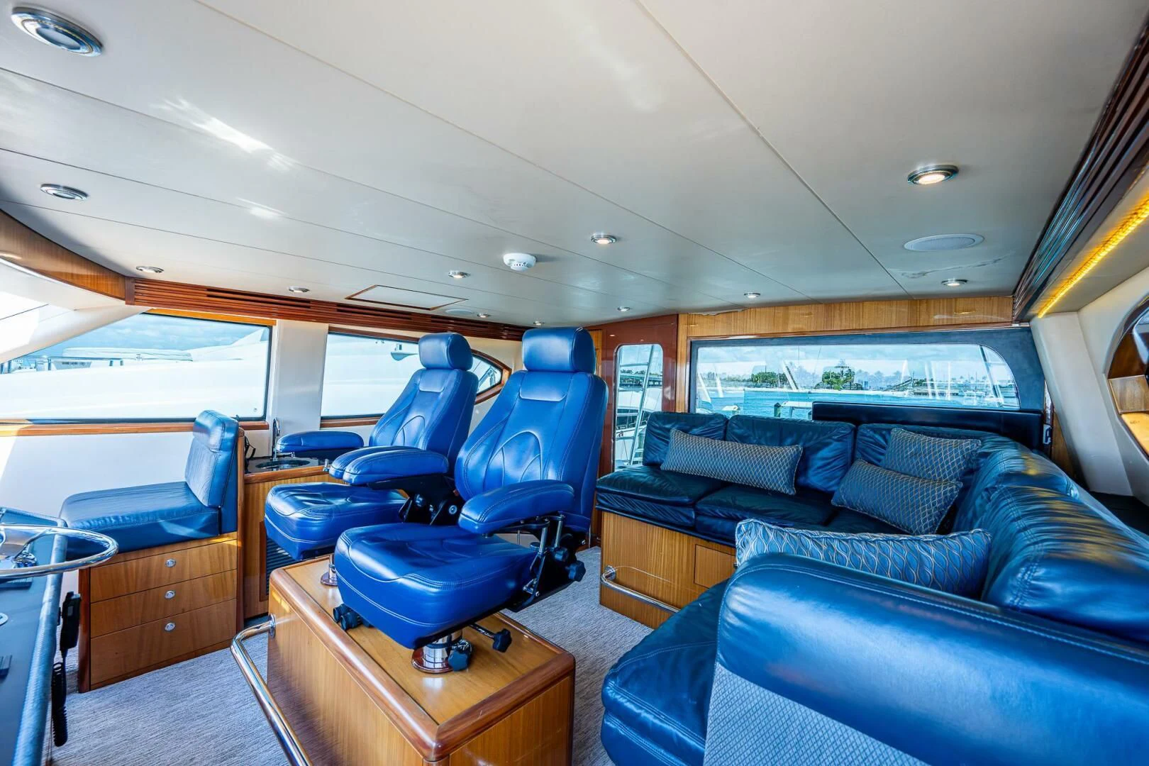 a vehicle with seats and a table aboard W Yacht for Sale