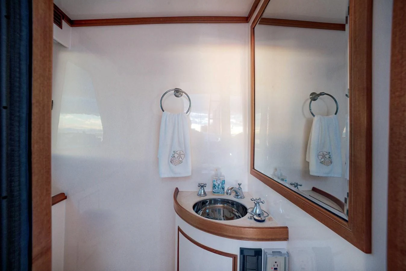 a bathroom with a sink and mirror aboard JUBILEE Yacht for Sale