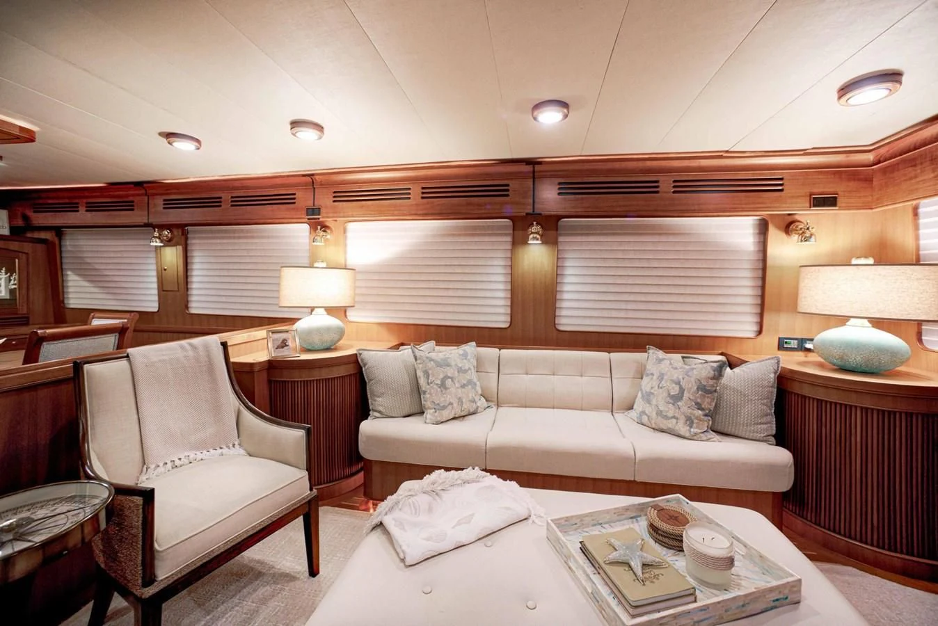a living room with a couch and a table aboard JUBILEE Yacht for Sale