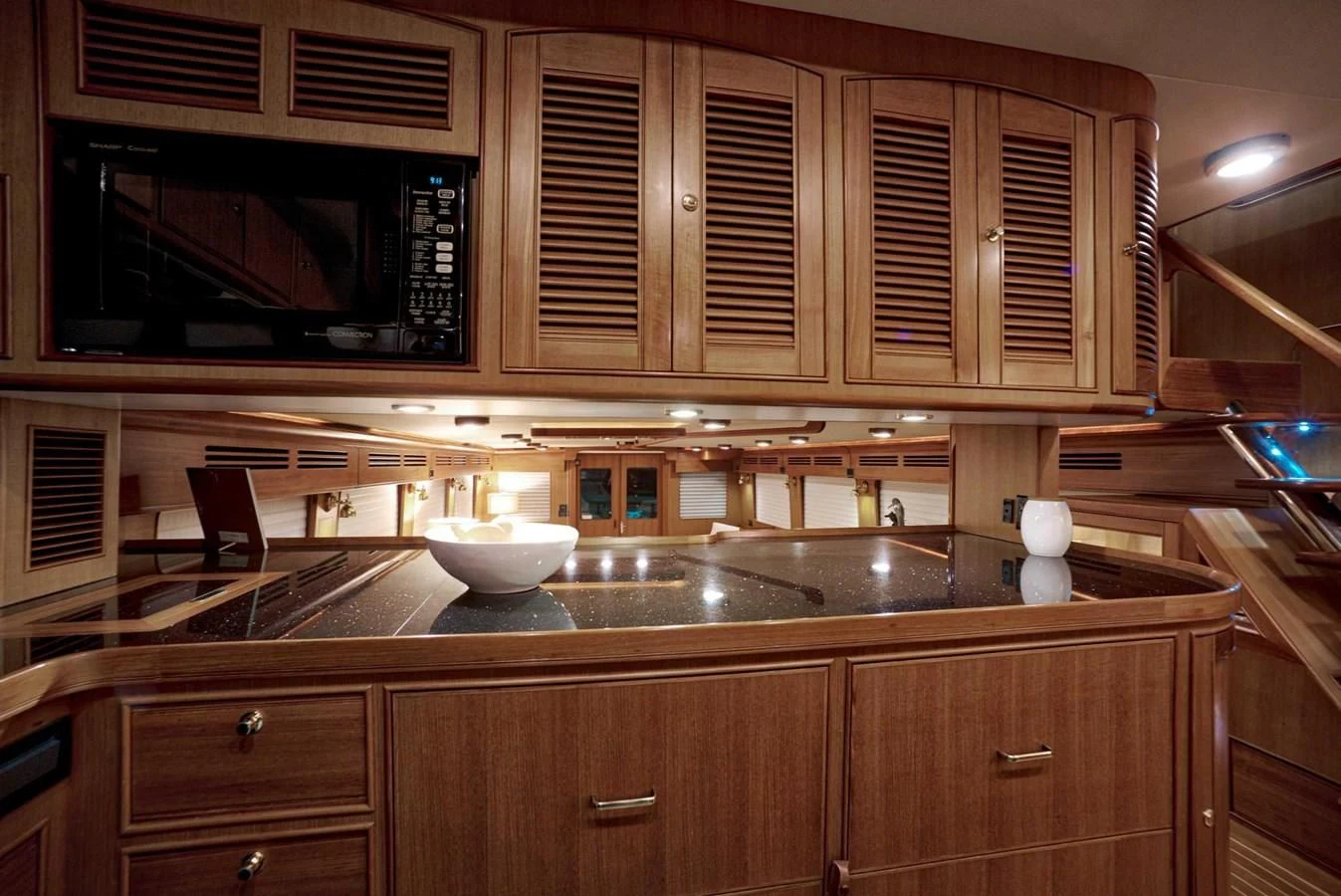 a kitchen with wooden cabinets aboard JUBILEE Yacht for Sale