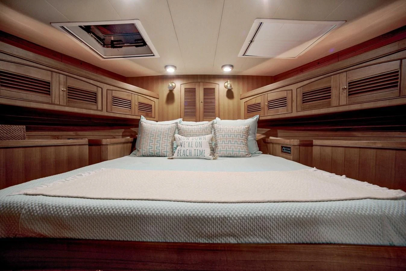 a large bed in a room aboard JUBILEE Yacht for Sale