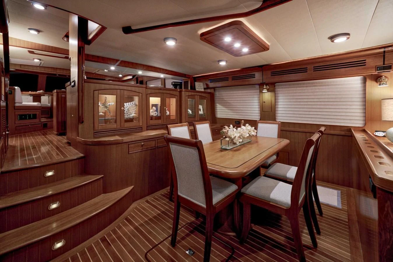 a large room with a table and chairs aboard JUBILEE Yacht for Sale