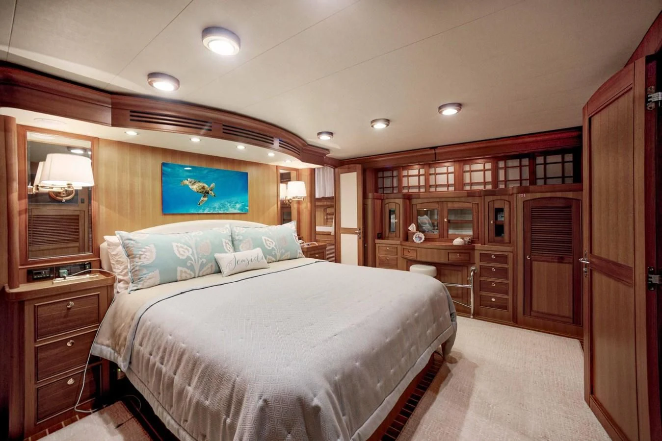 a bedroom with a bed and a desk aboard JUBILEE Yacht for Sale