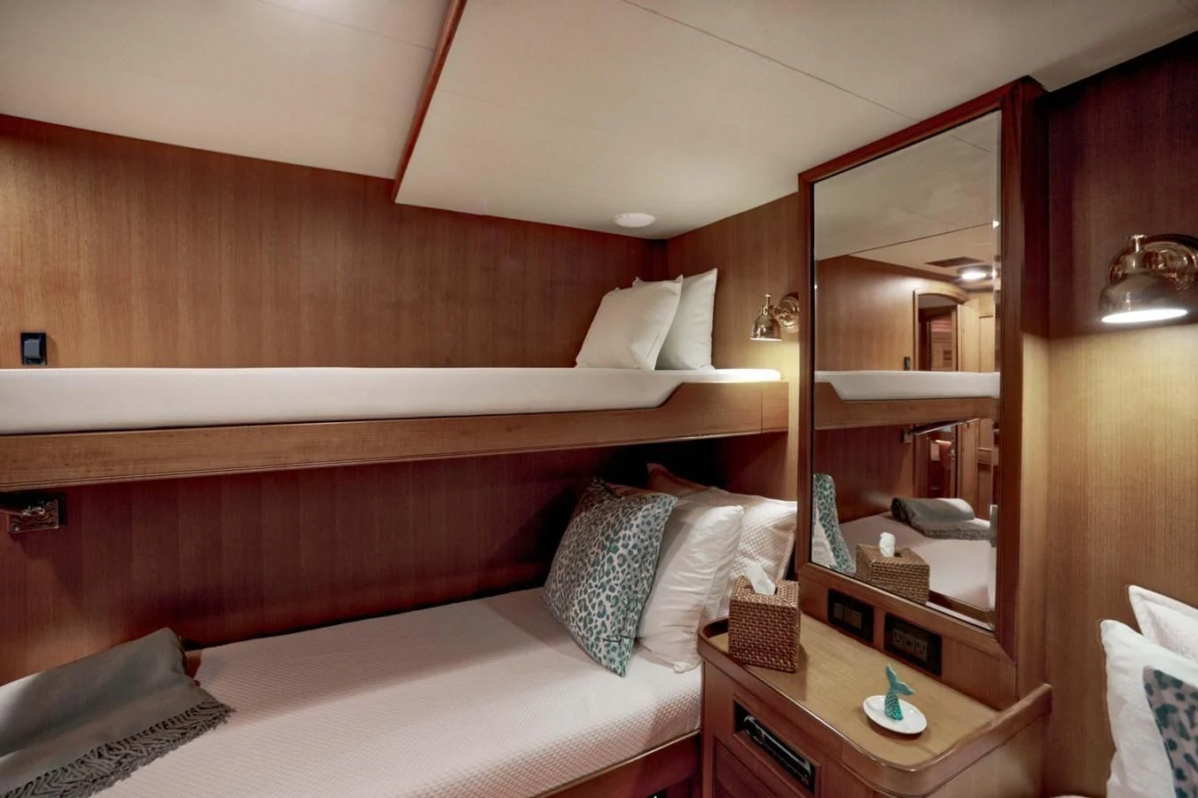 a bed with a wooden headboard aboard JUBILEE Yacht for Sale