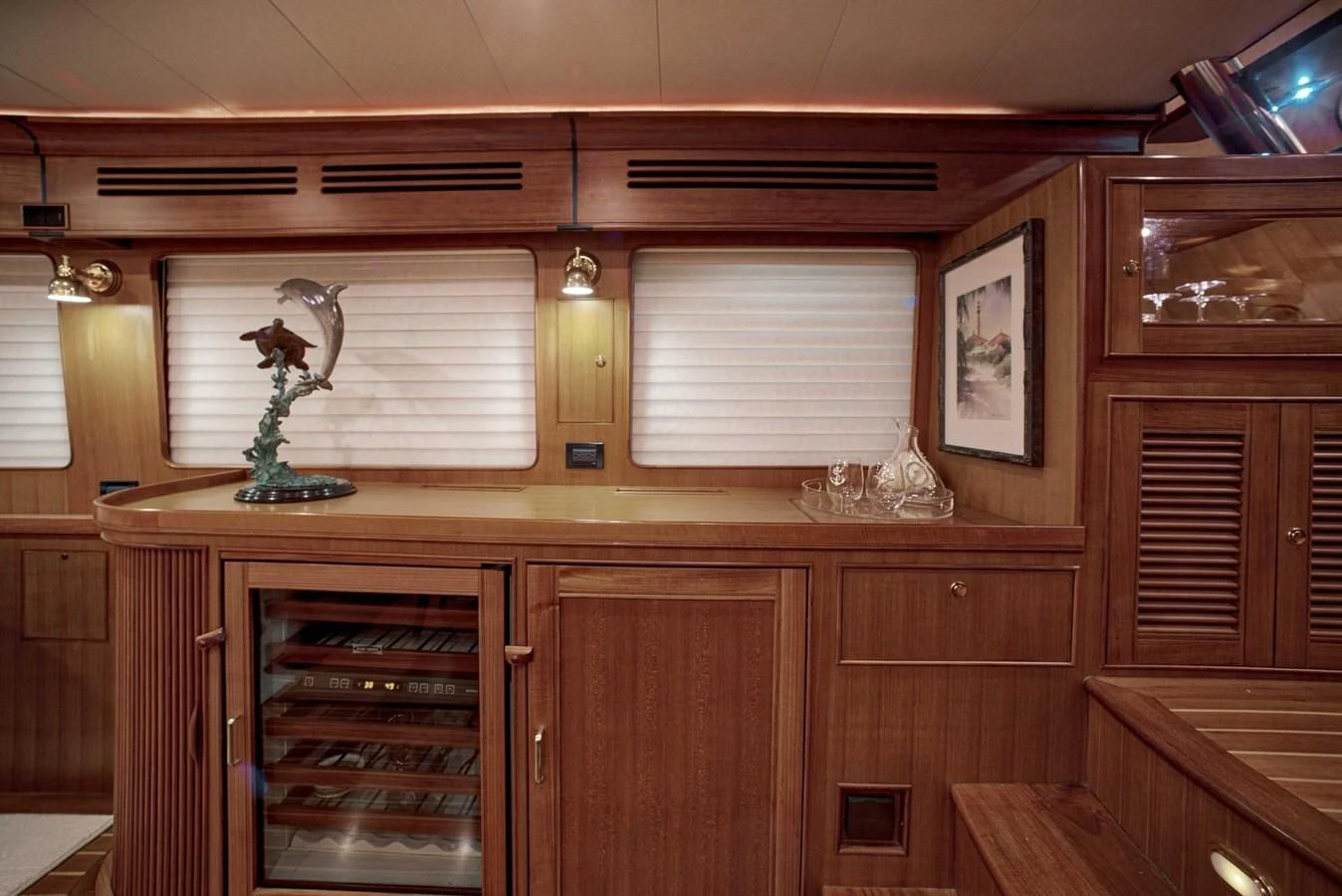 a kitchen with wooden cabinets aboard JUBILEE Yacht for Sale