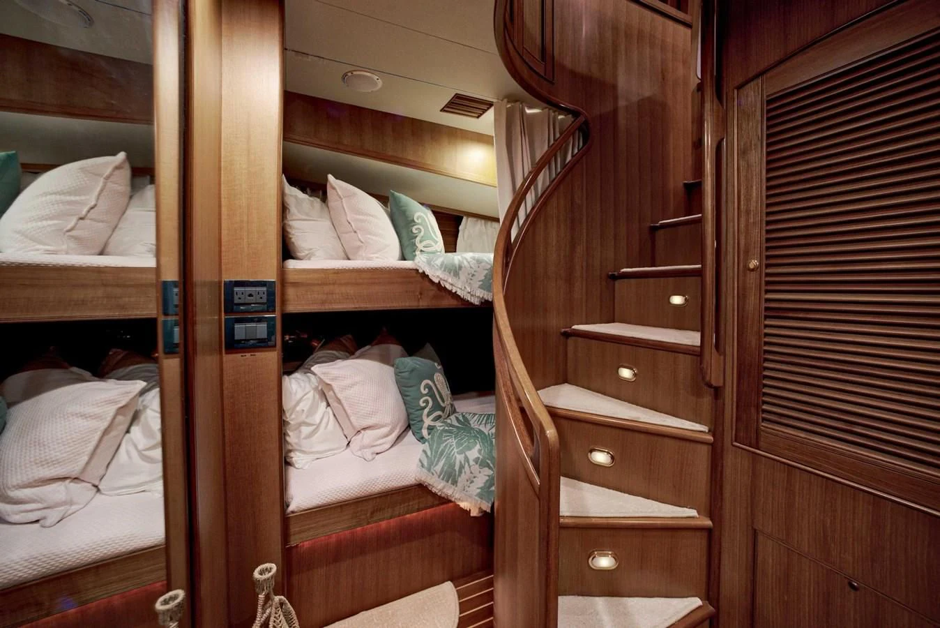 a bunk bed with a desk aboard JUBILEE Yacht for Sale
