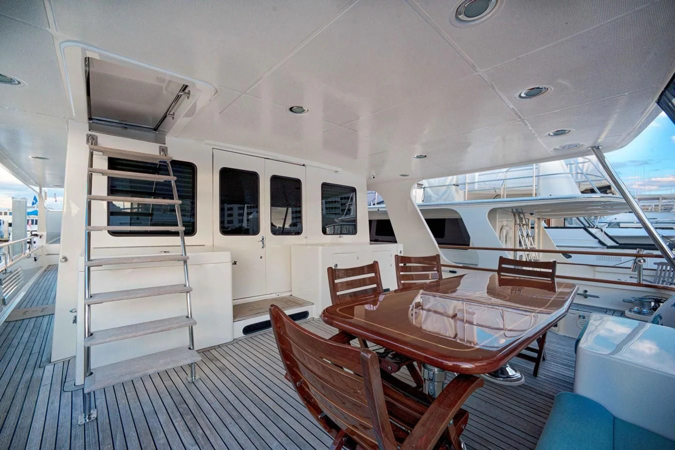 a boat with a table and chairs aboard JUBILEE Yacht for Sale