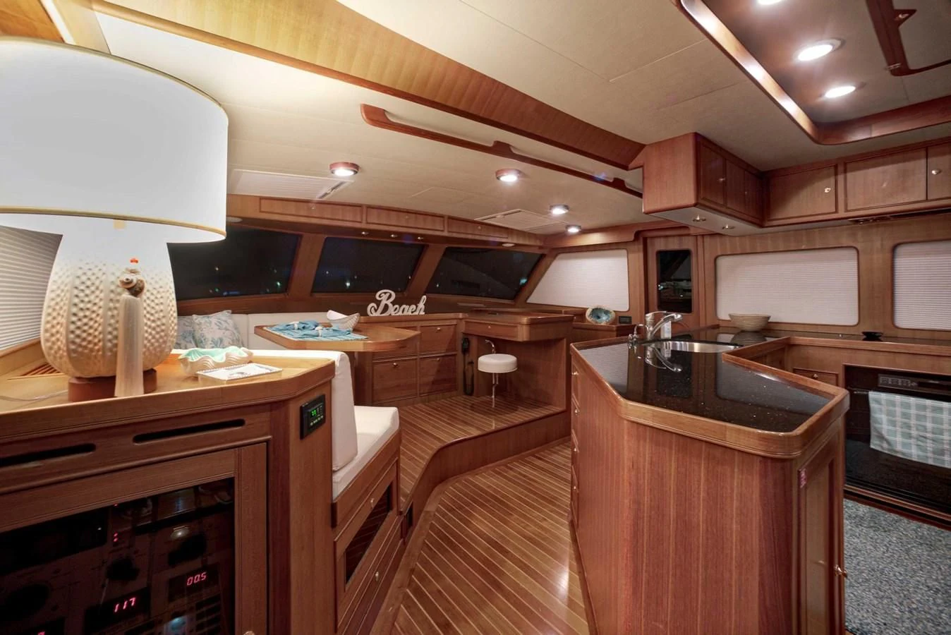 a kitchen with wooden cabinets aboard JUBILEE Yacht for Sale