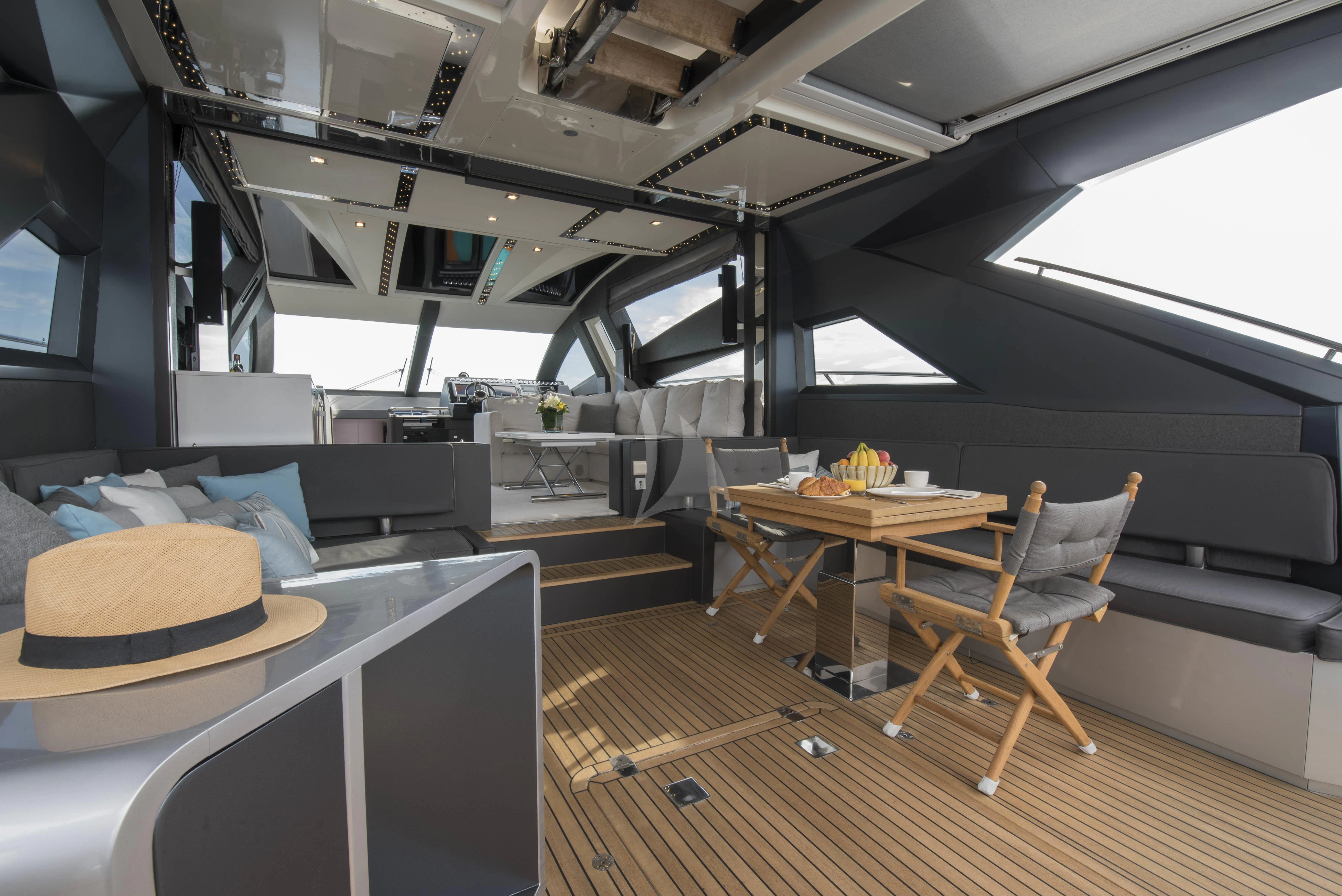 a room with a table and chairs aboard MORRIGAN Yacht for Sale