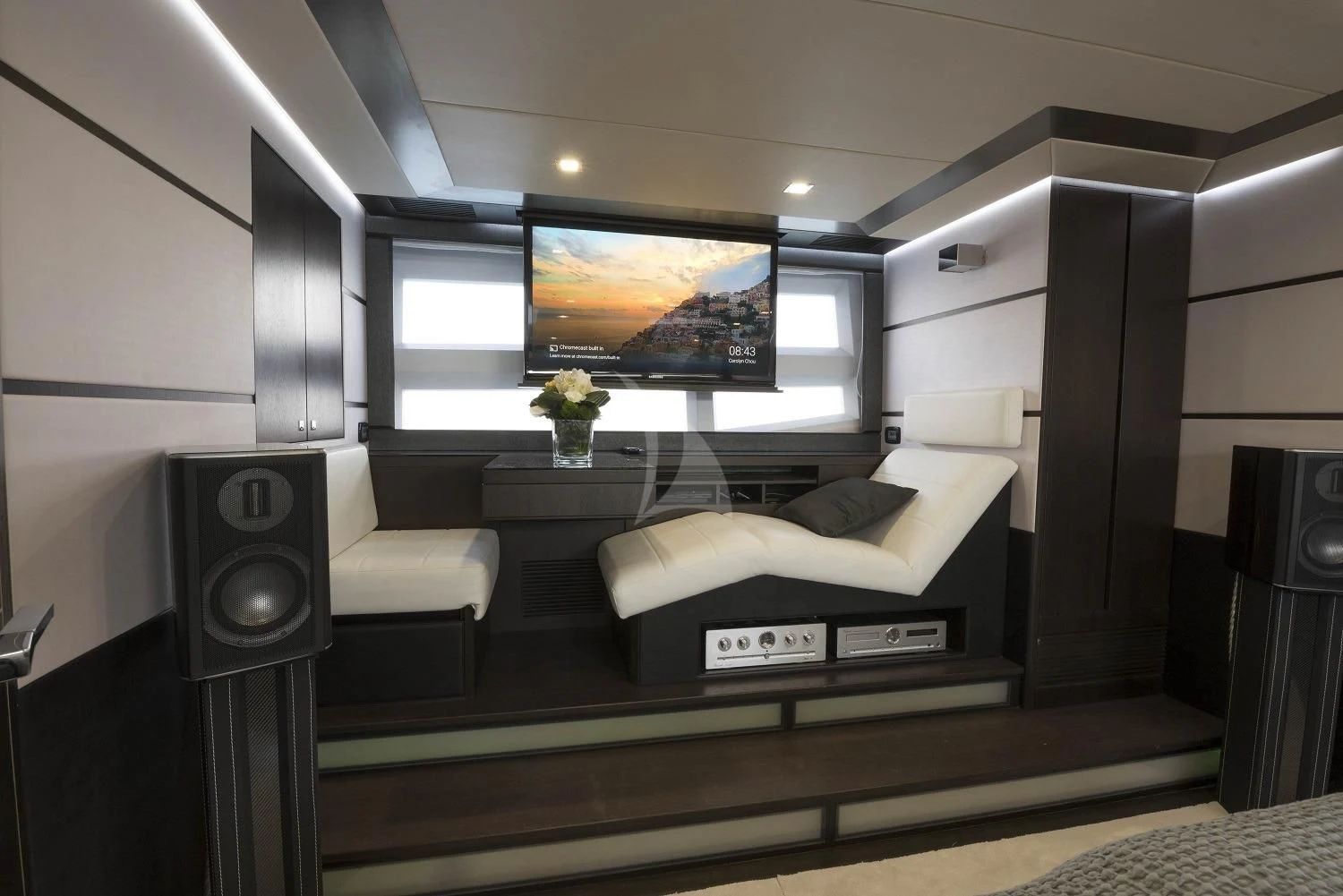 a living room with a large screen aboard MORRIGAN Yacht for Sale