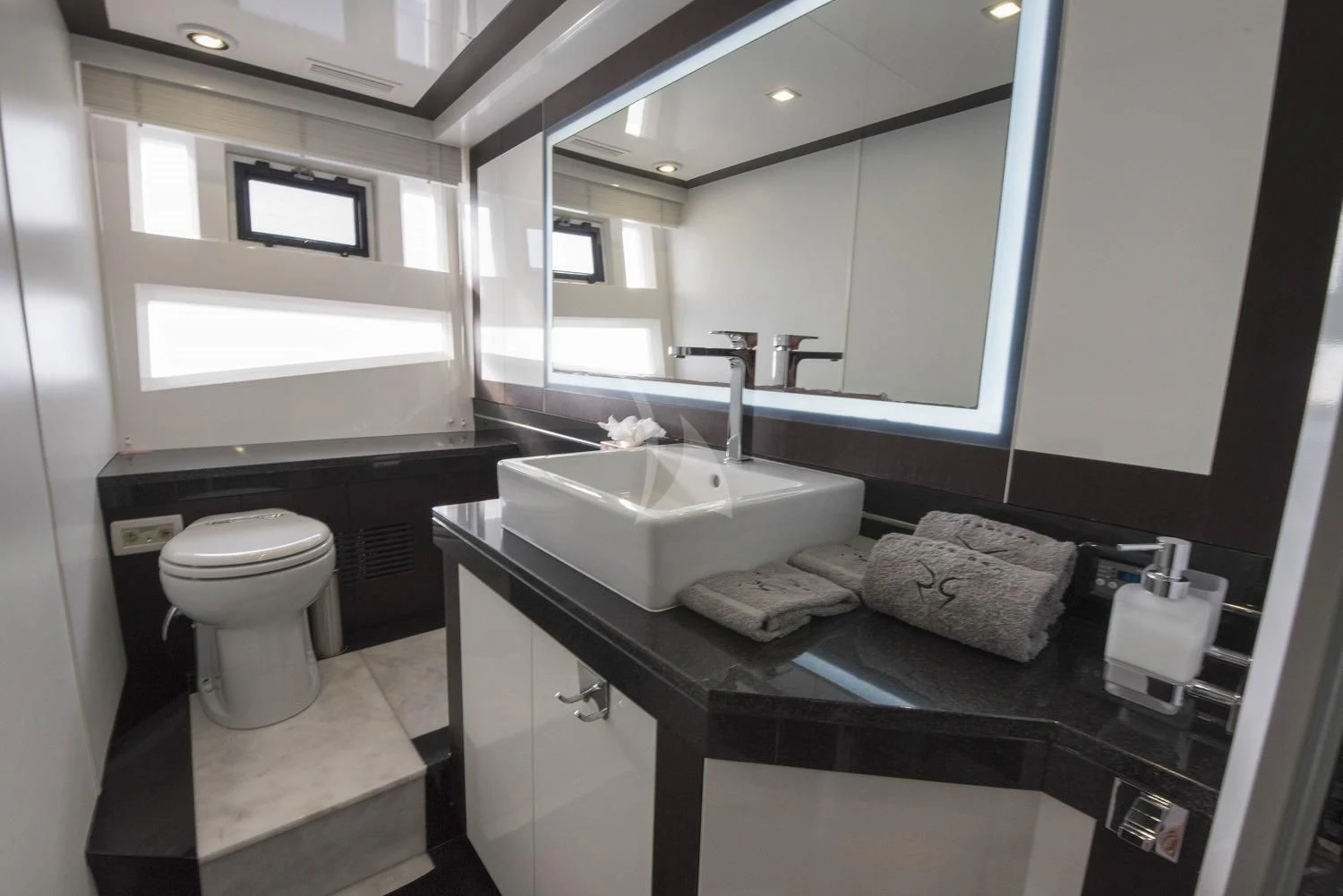 a bathroom with a sink and a mirror aboard MORRIGAN Yacht for Sale
