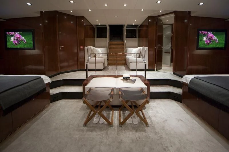 a room with a table and chairs aboard MYSTERE Yacht for Sale