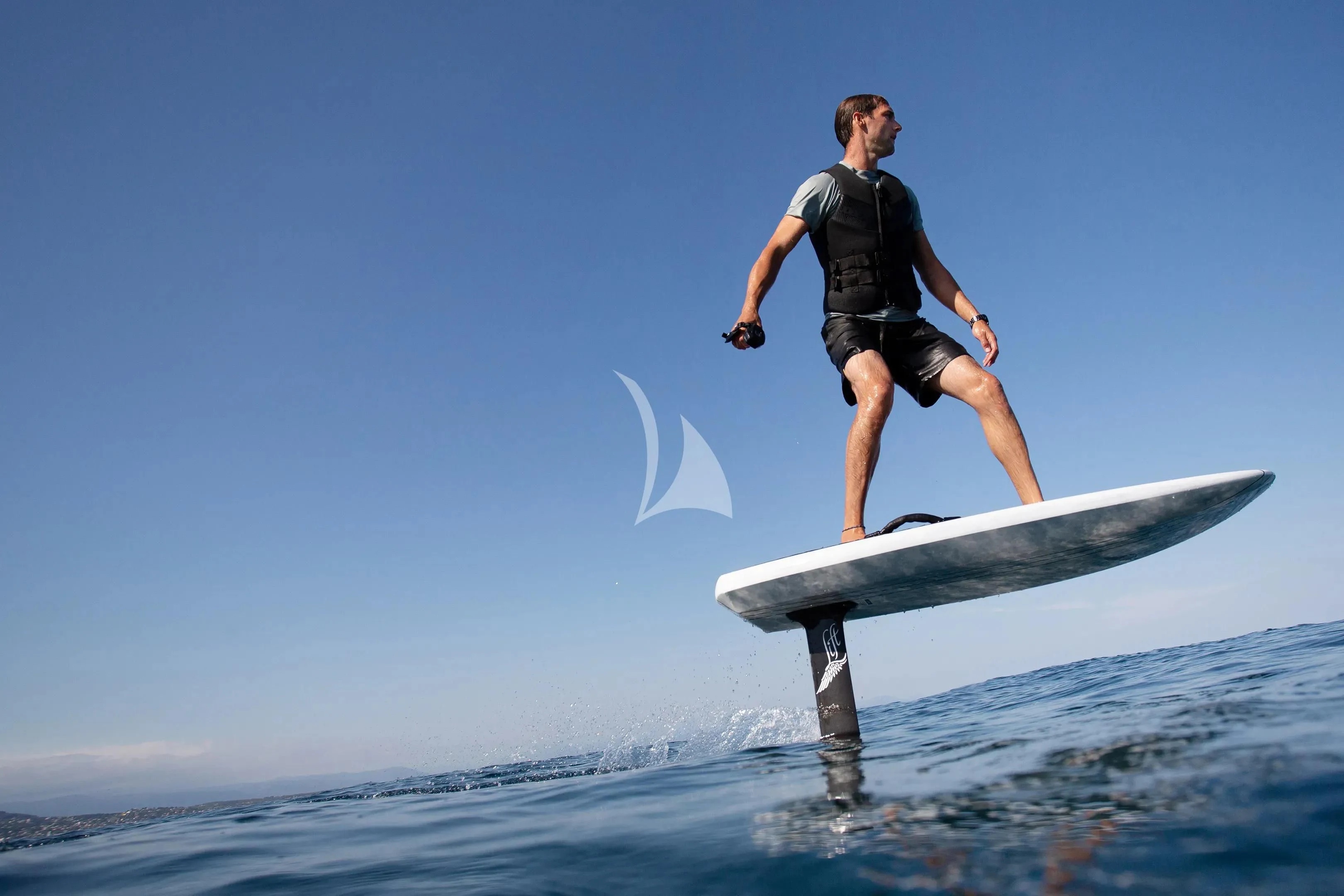 a man on a surfboard aboard MYSTERE Yacht for Sale