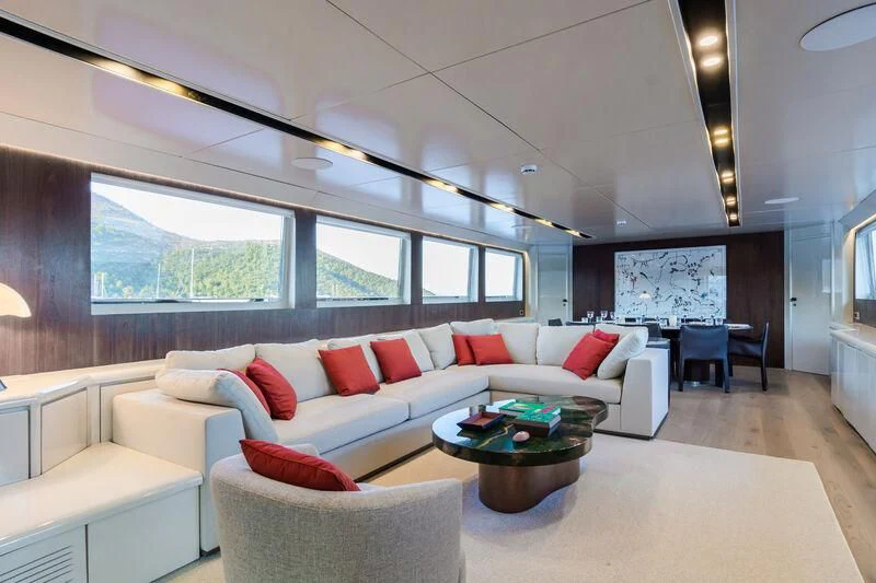 a living room with a large window aboard AXELLA Yacht for Sale