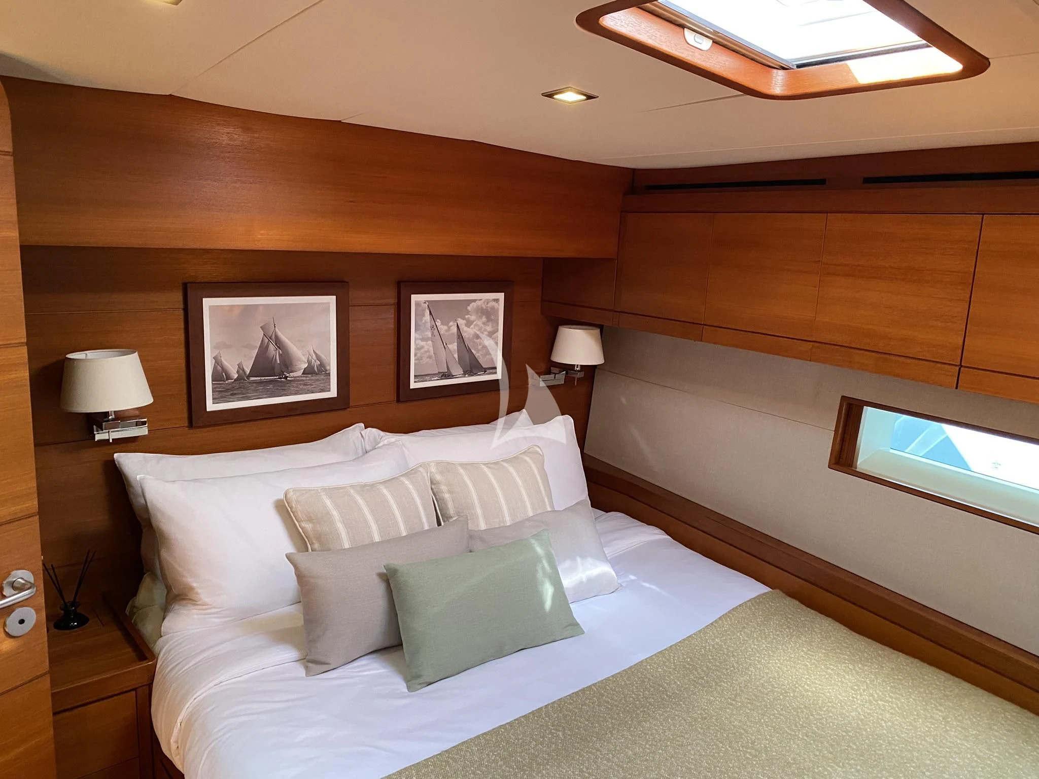 a hotel room with a bed and a television aboard ACAIA Yacht for Sale