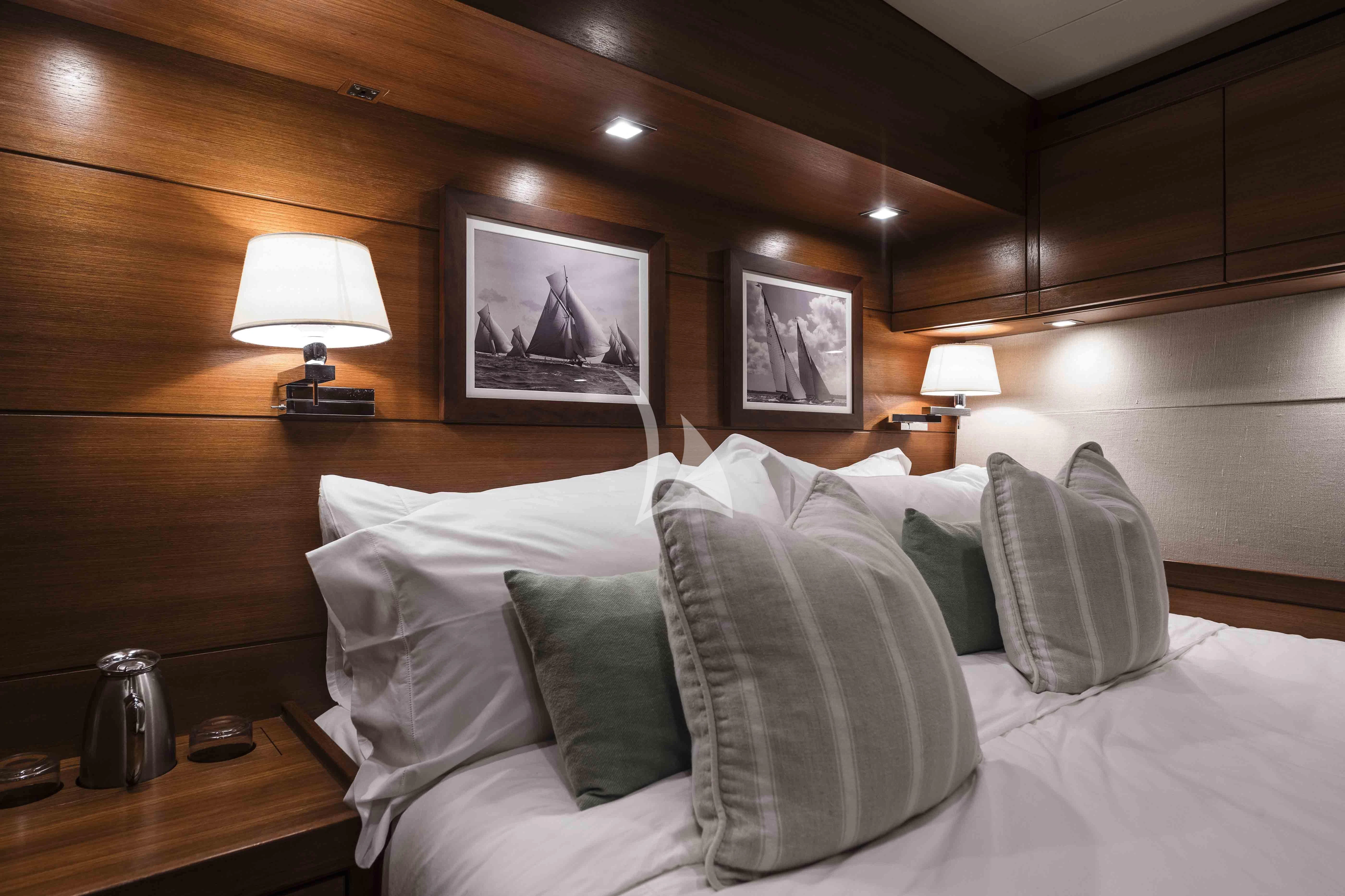 a bed with pillows and pillows aboard ACAIA Yacht for Sale