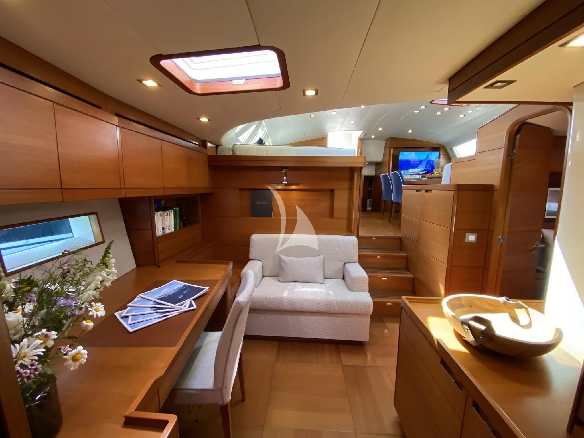 a room with a bed and a table aboard ACAIA Yacht for Sale