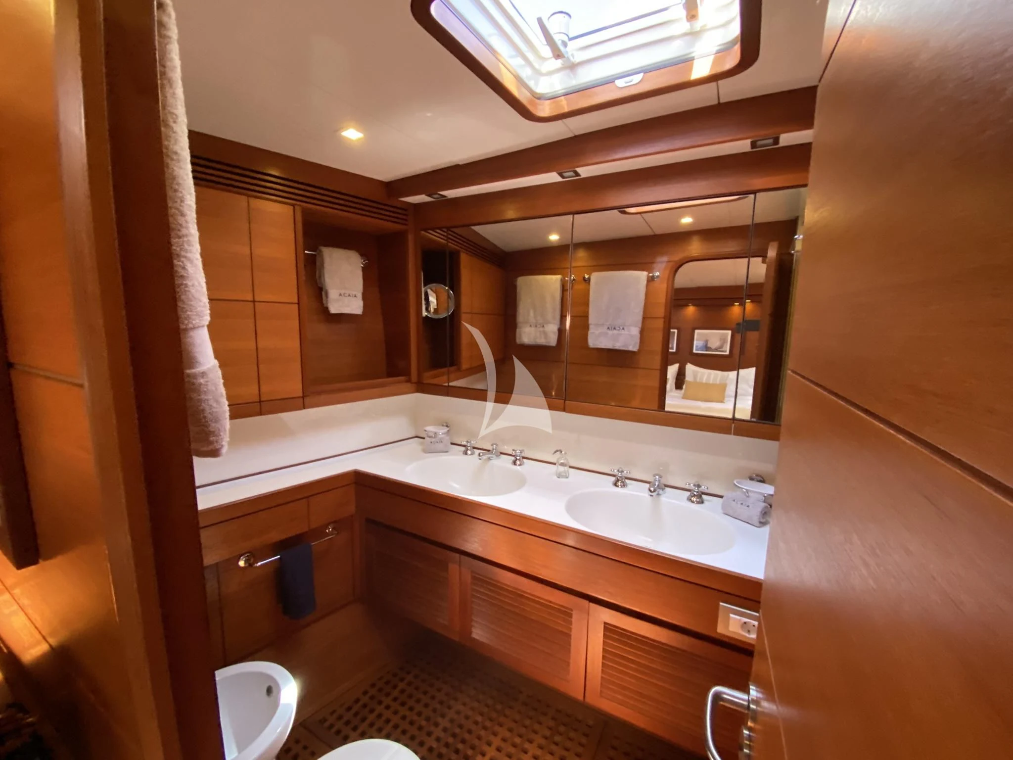 a bathroom with a large mirror aboard ACAIA Yacht for Sale
