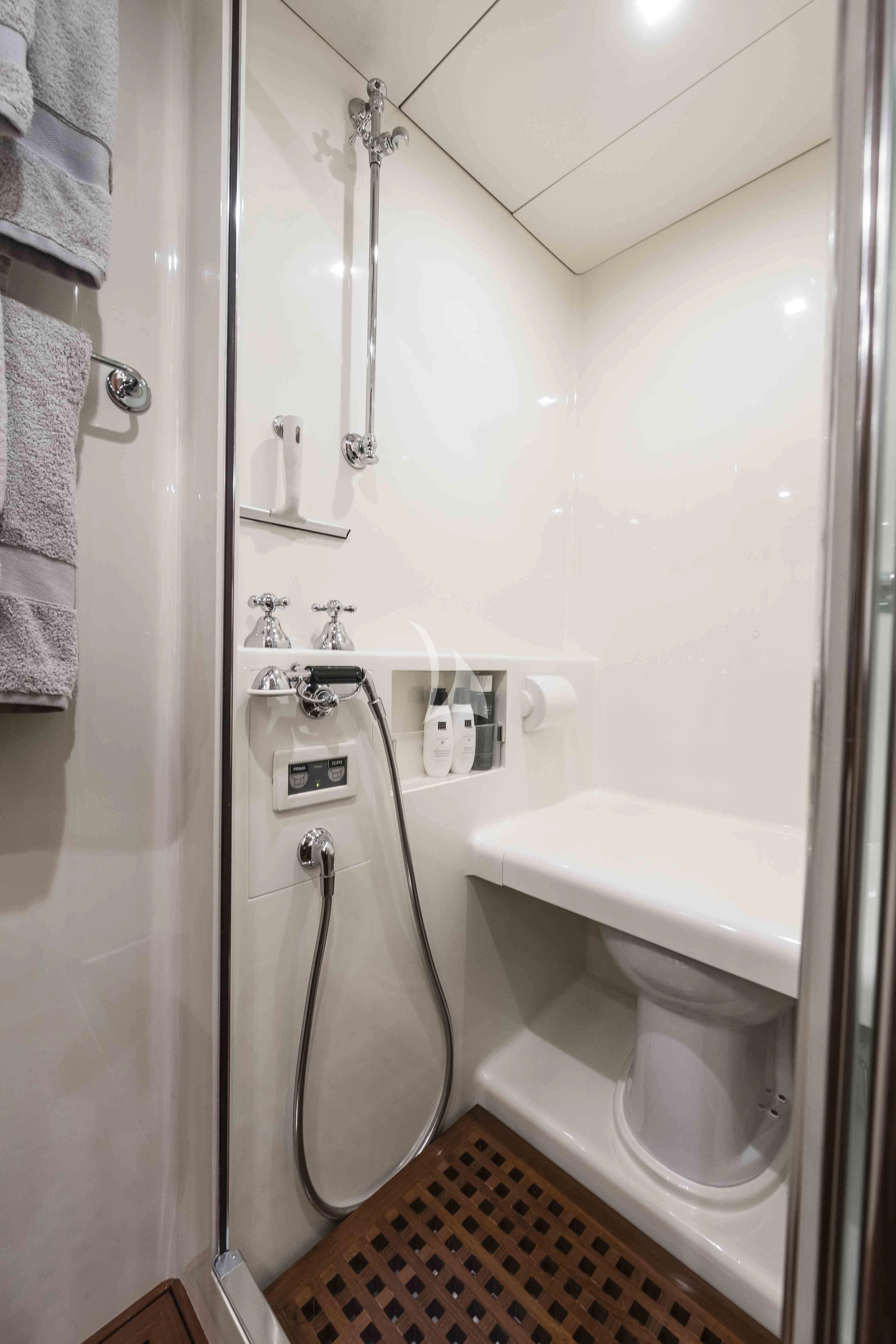 a bathroom with a urinal and sink aboard ACAIA Yacht for Sale