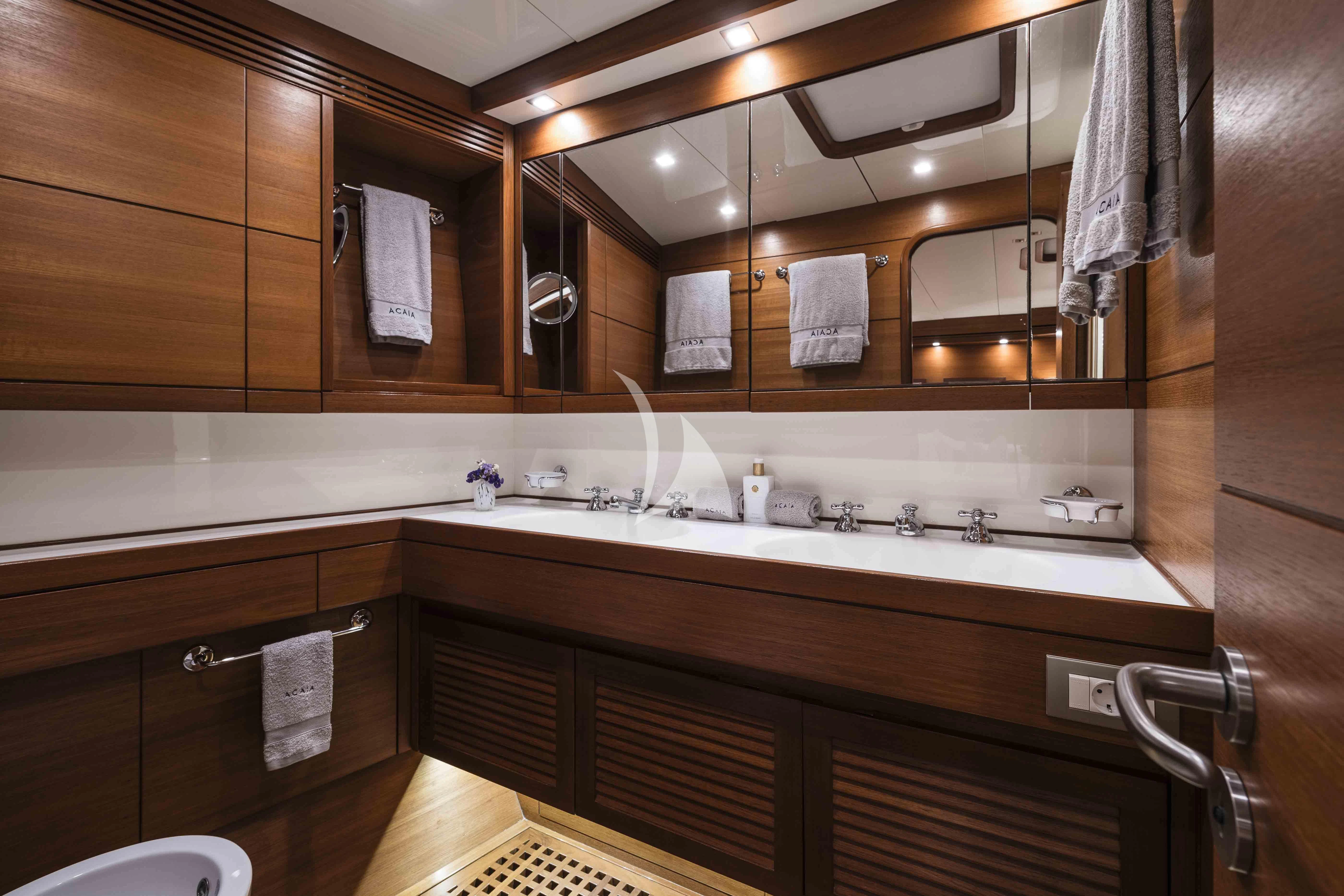 a bathroom with a large mirror aboard ACAIA Yacht for Sale