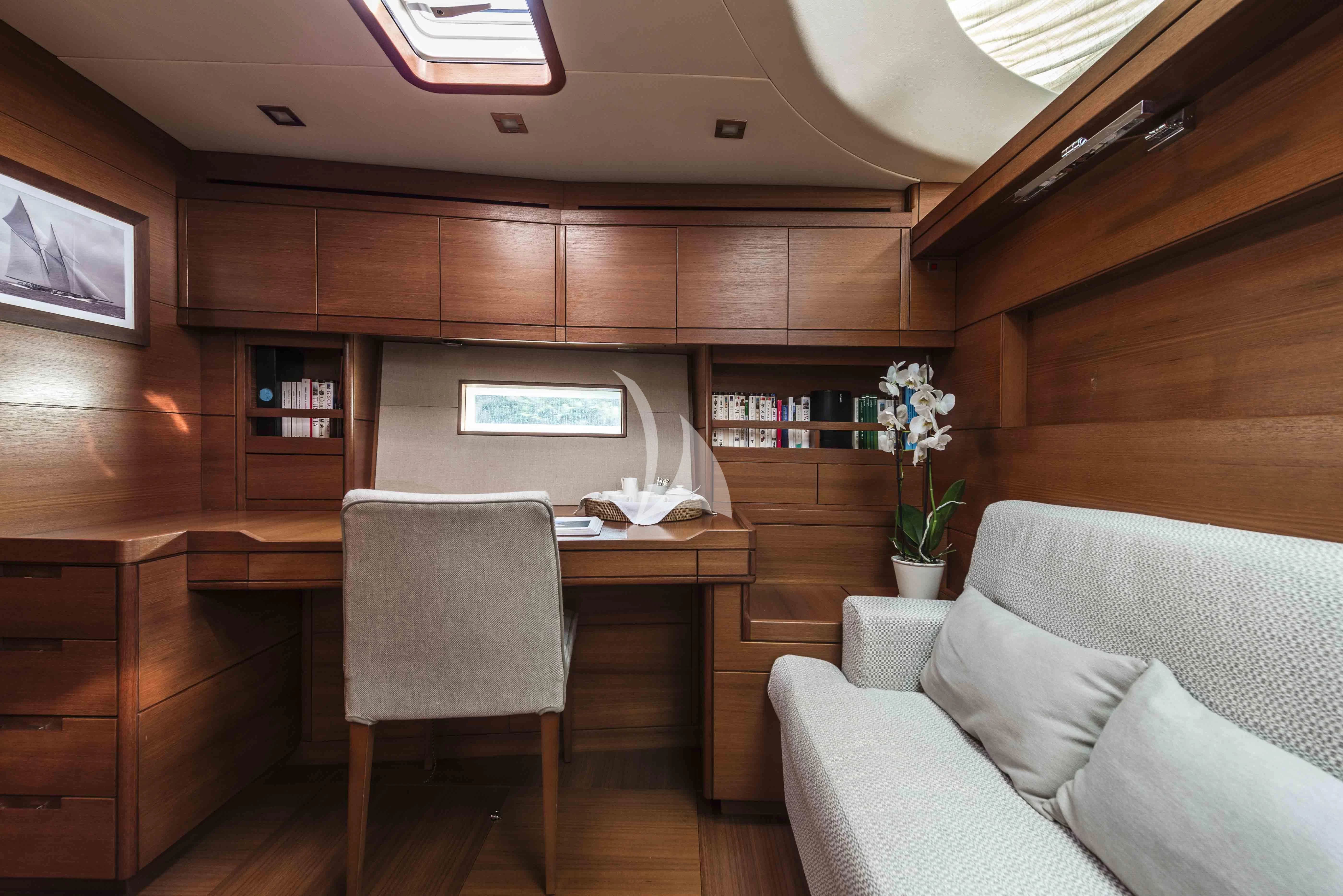 a room with a couch and a tv aboard ACAIA Yacht for Sale