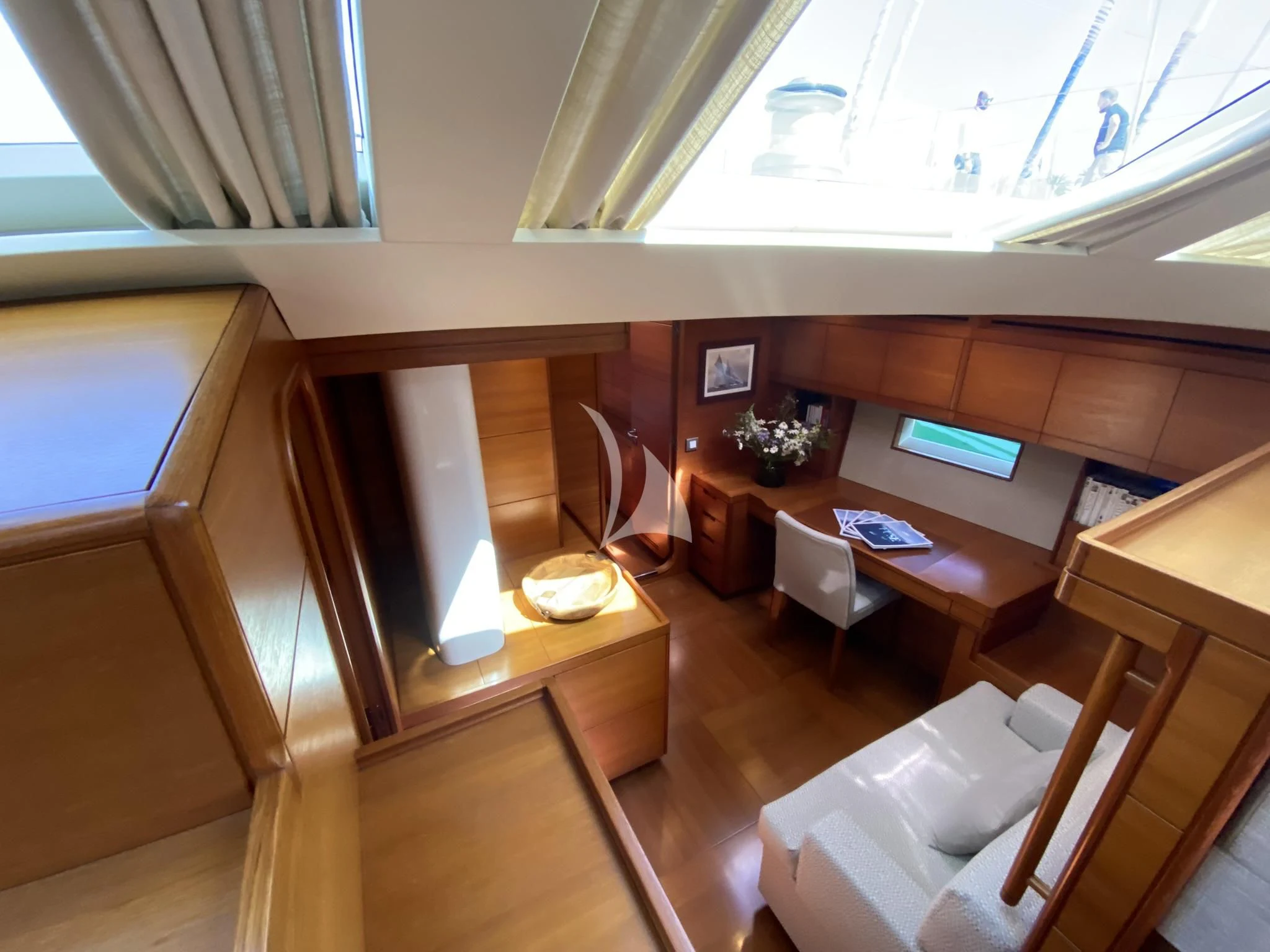 a room with a table and chairs aboard ACAIA Yacht for Sale