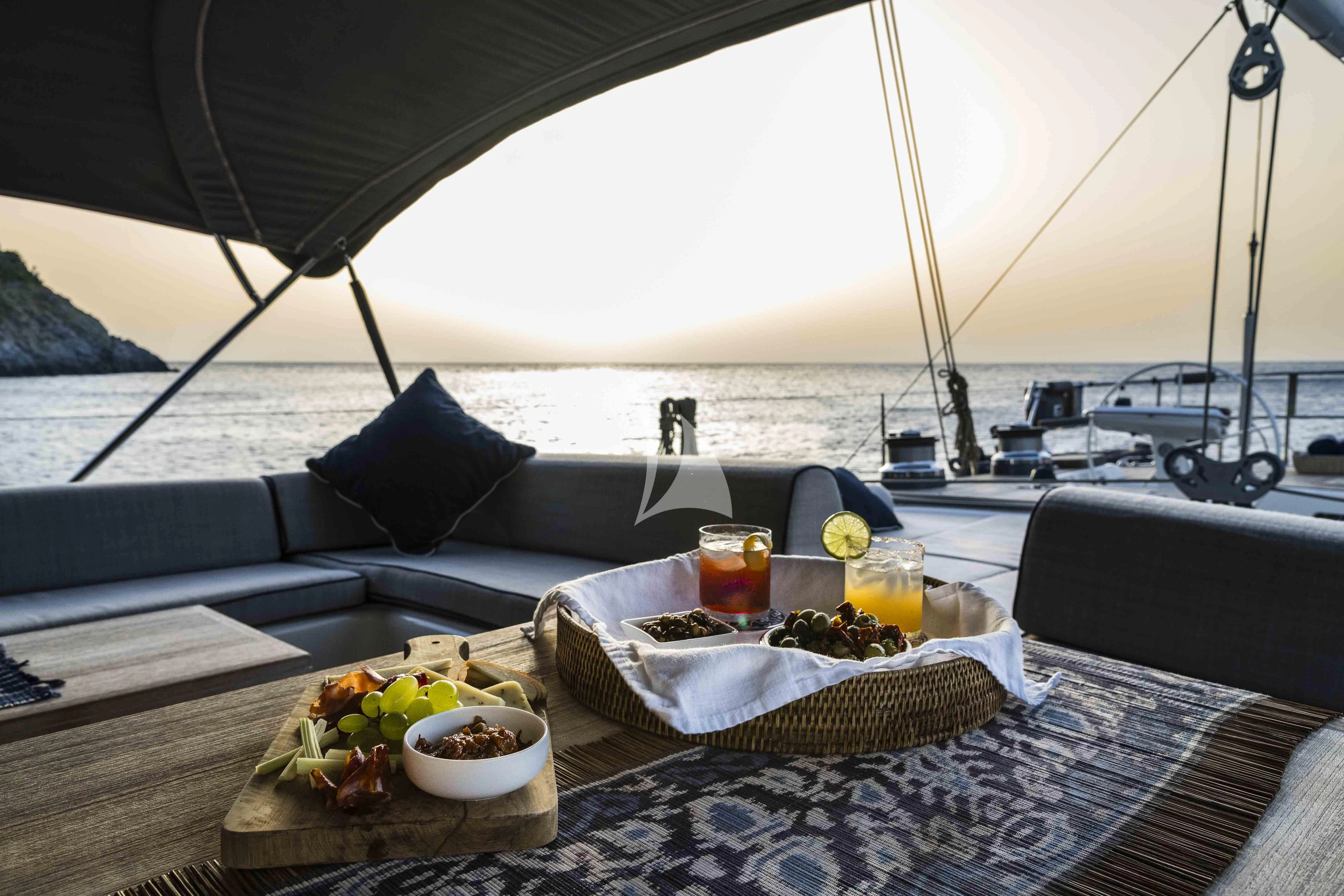 a table with food on it aboard ACAIA Yacht for Sale