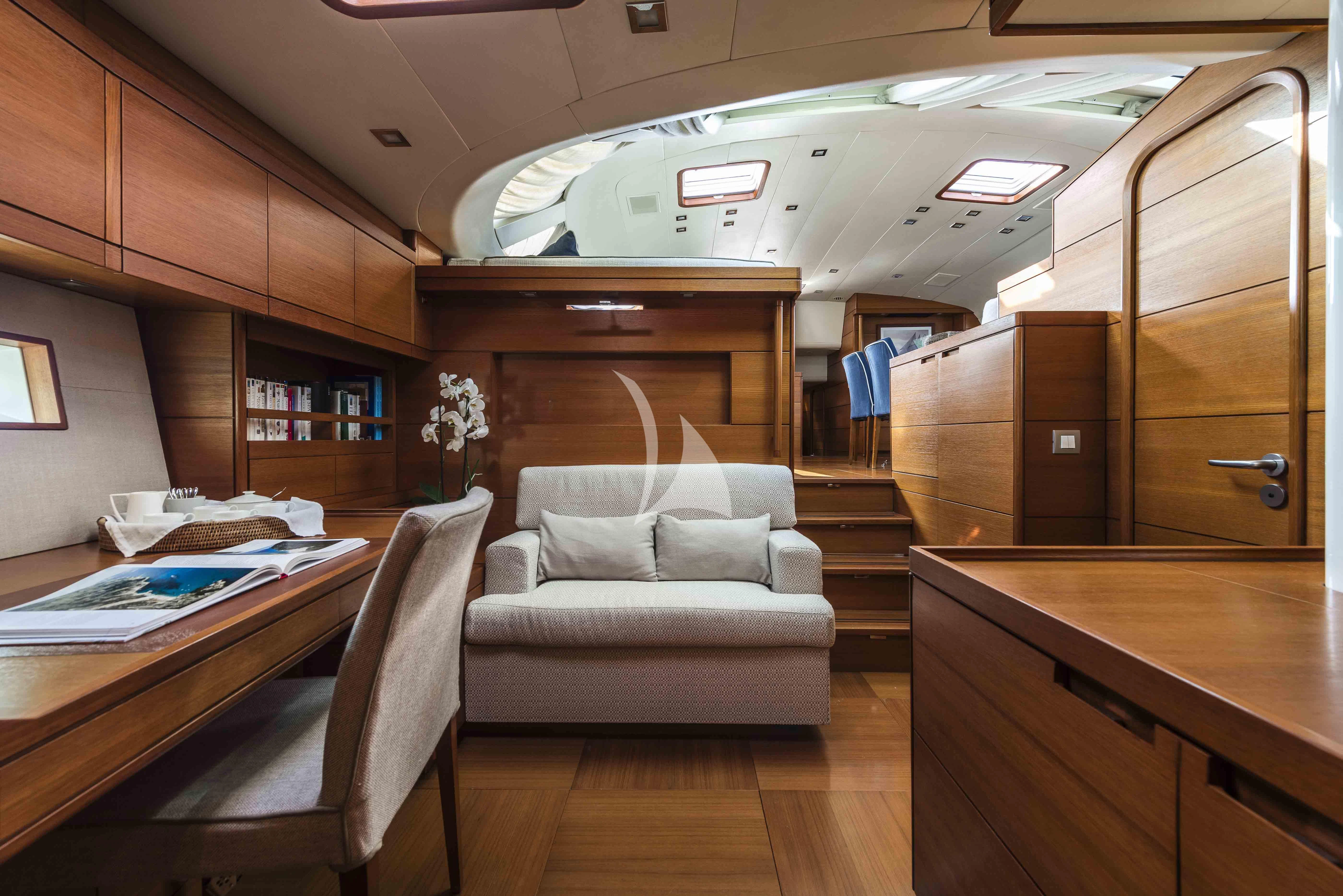 a room with a couch and a table aboard ACAIA Yacht for Sale