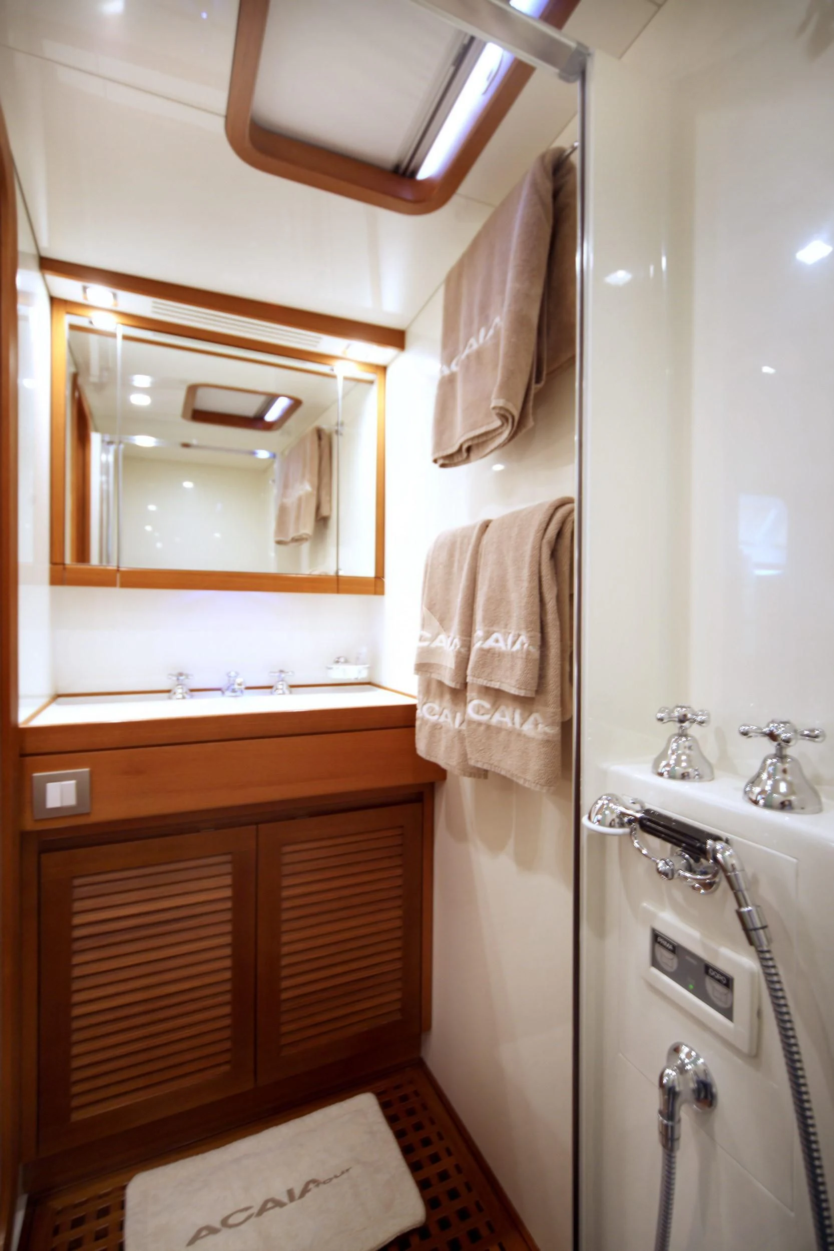 a bathroom with a towel on the wall aboard ACAIA Yacht for Sale