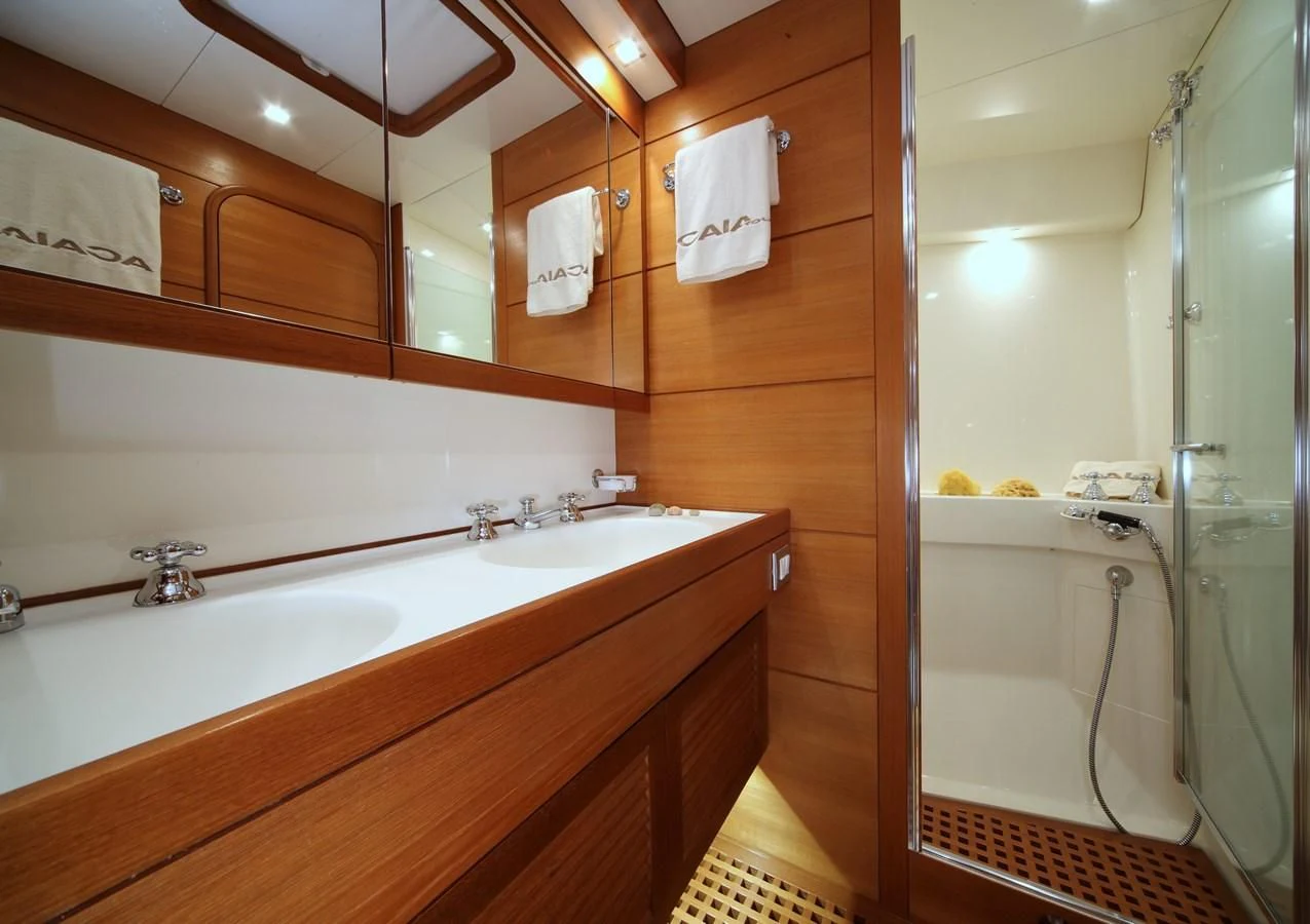a bathroom with a large mirror aboard ACAIA Yacht for Sale
