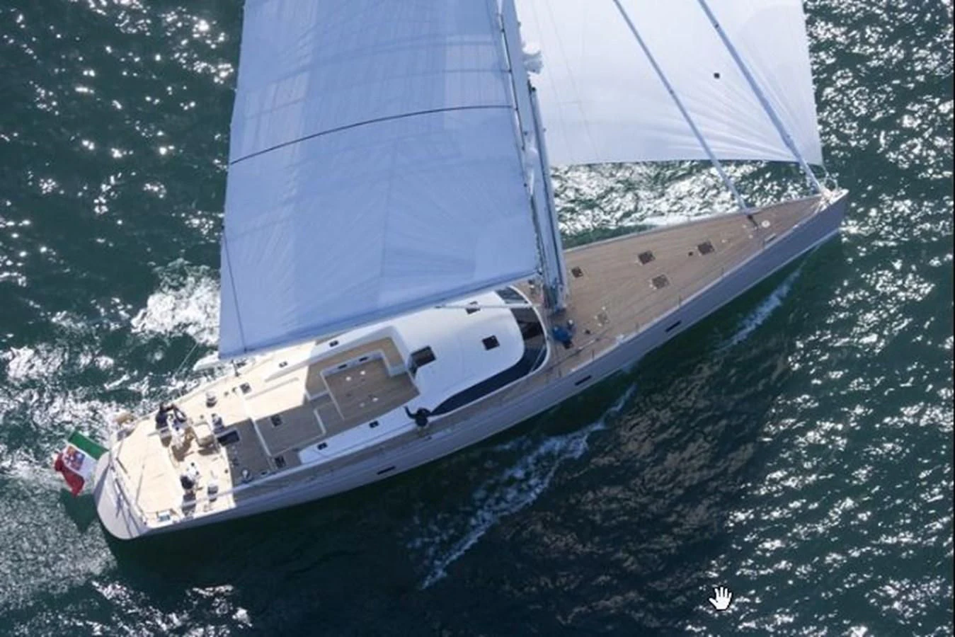 a white sailboat on the water aboard ACAIA Yacht for Sale