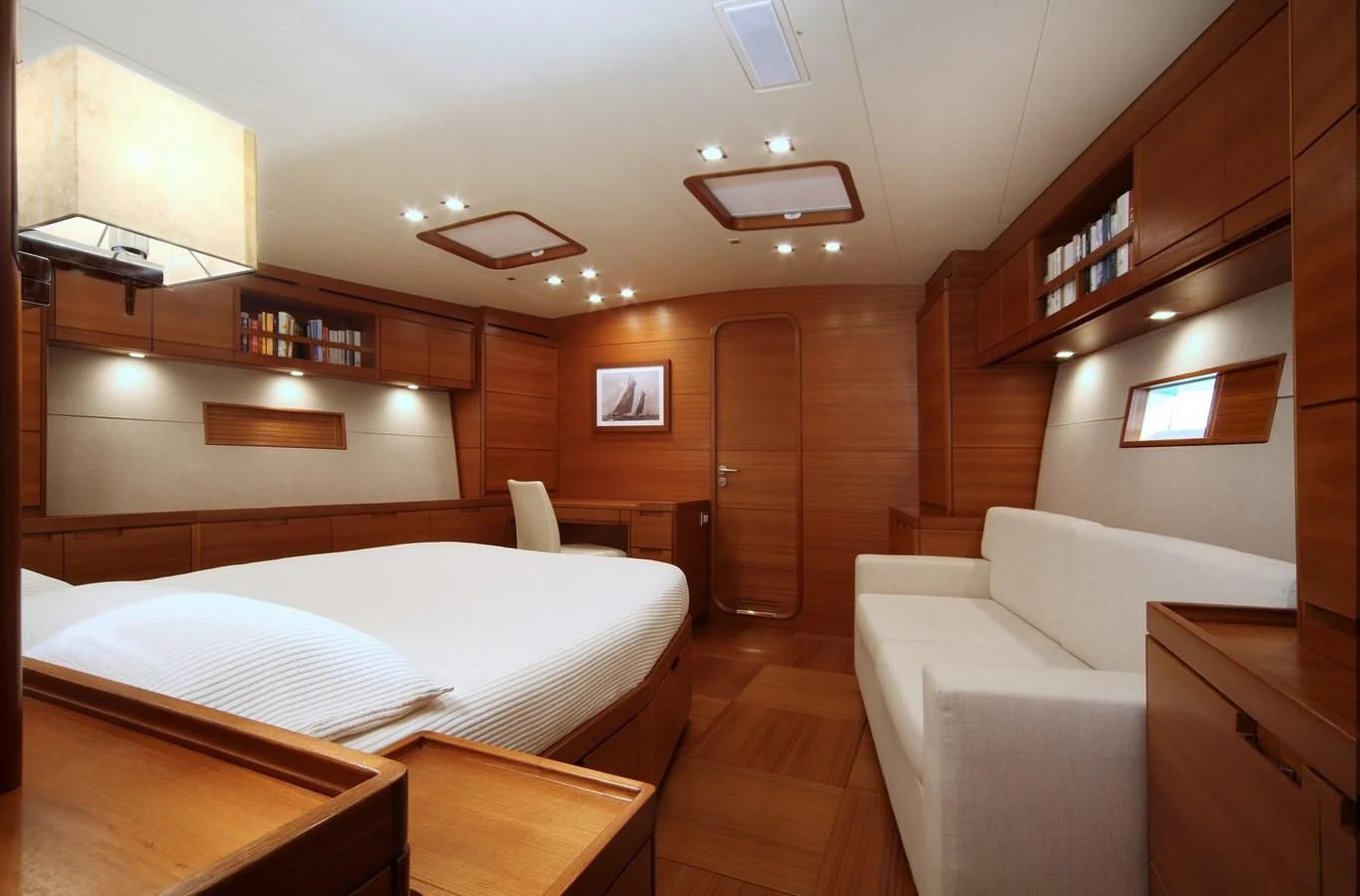 a room with a bed and a couch aboard ACAIA Yacht for Sale