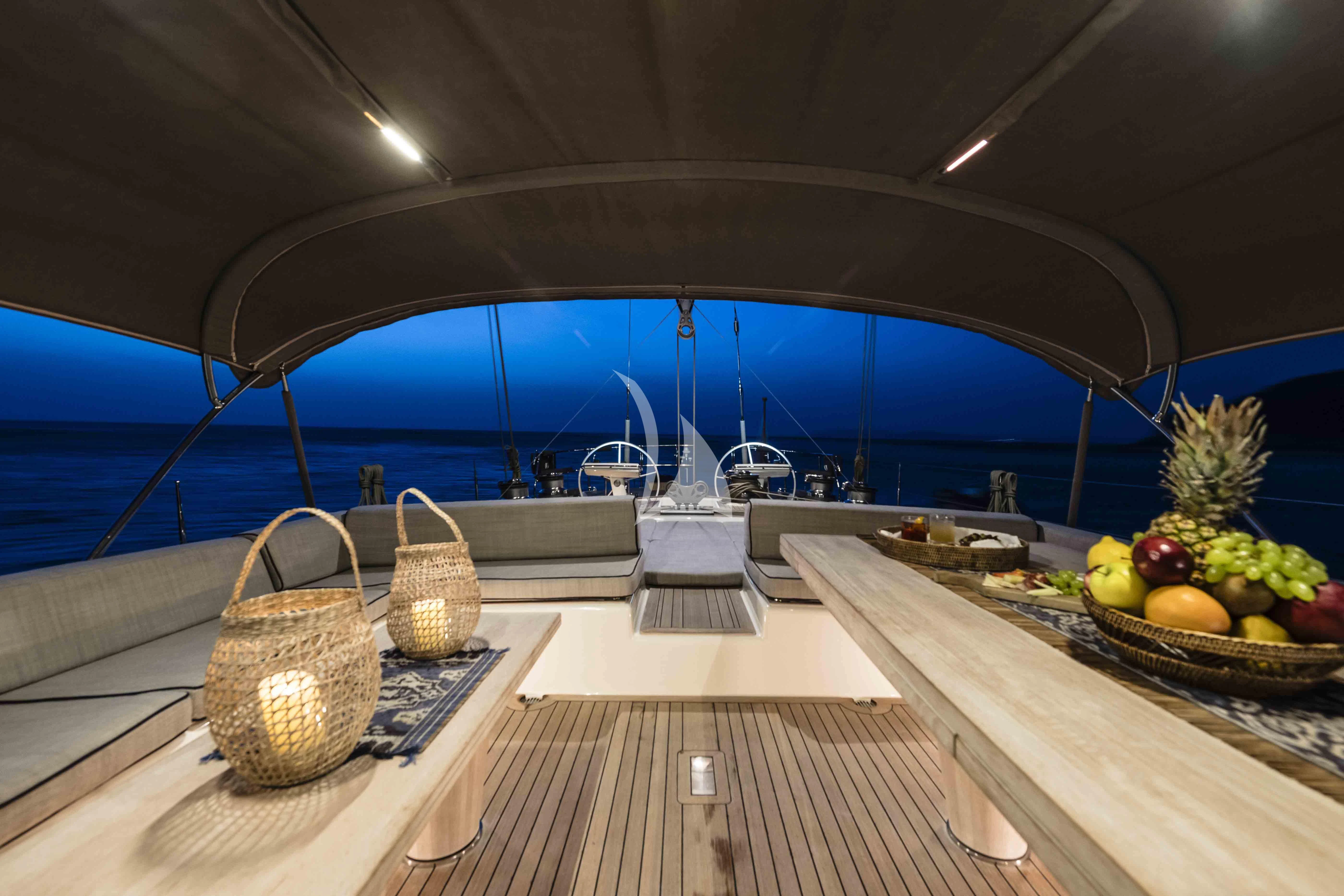a table with baskets and fruit on it aboard ACAIA Yacht for Sale