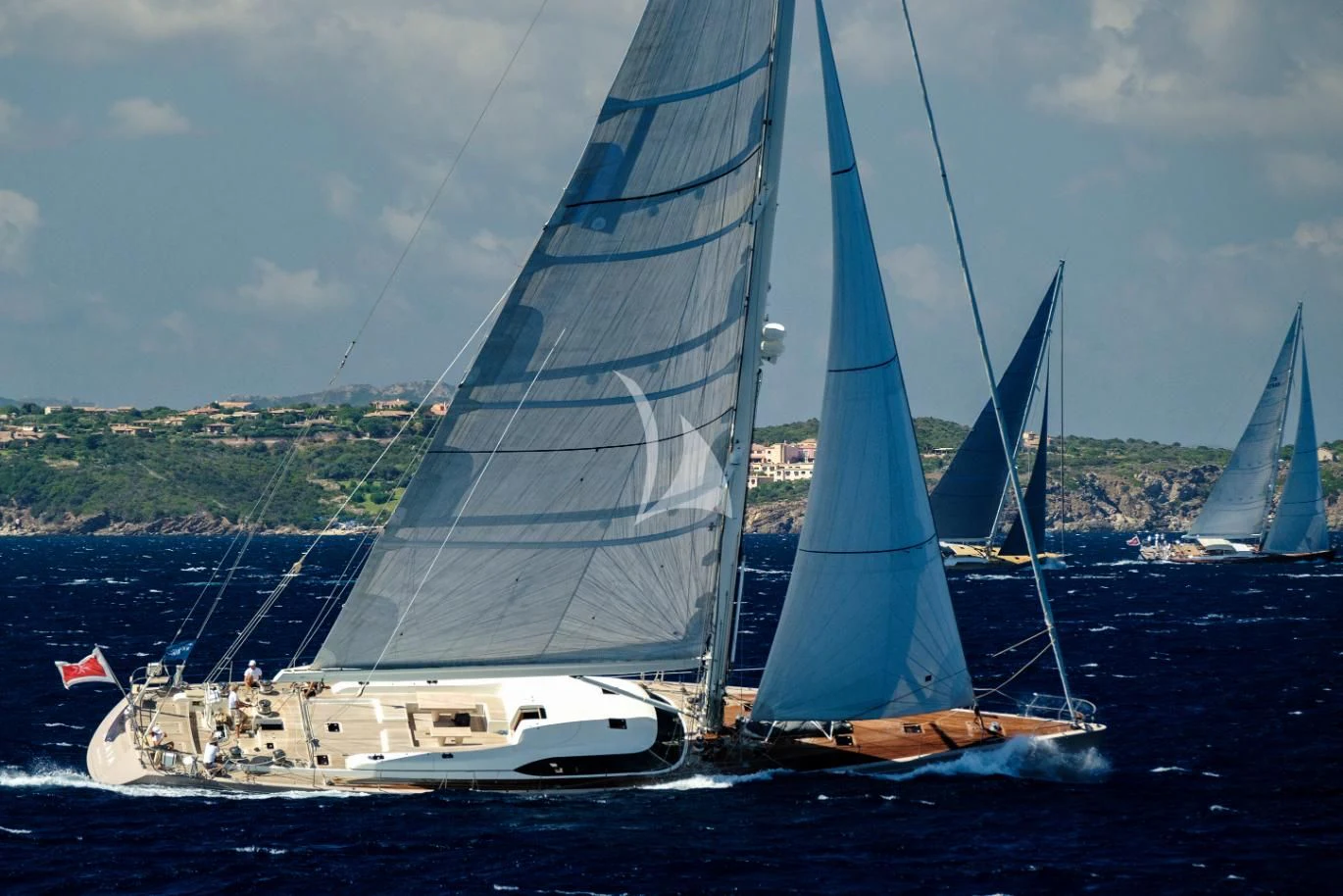 a group of sailboats on the water aboard ACAIA Yacht for Sale